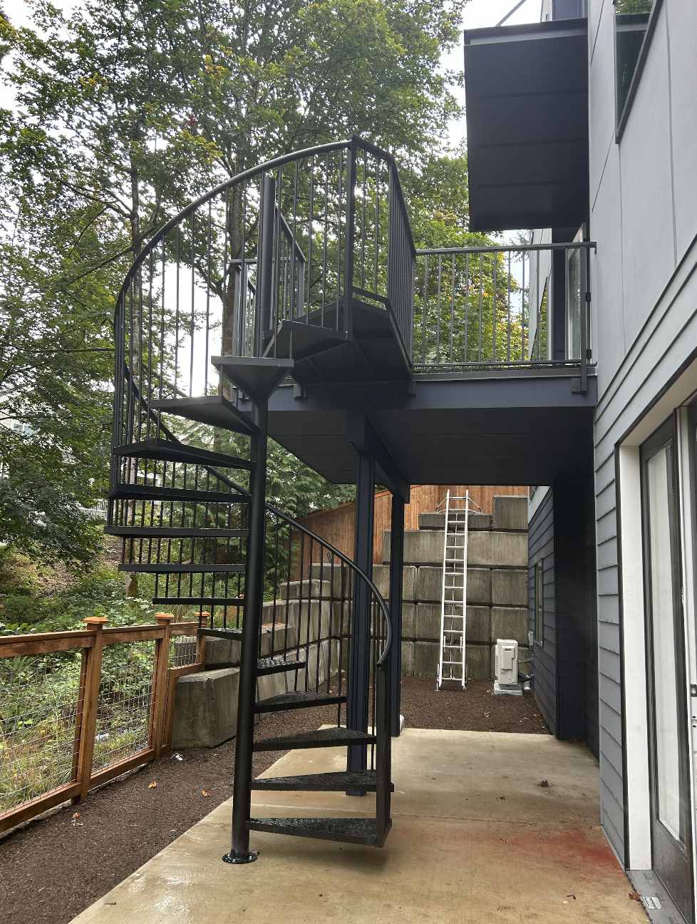 Custom spiral metal staircase with powder-coated finish