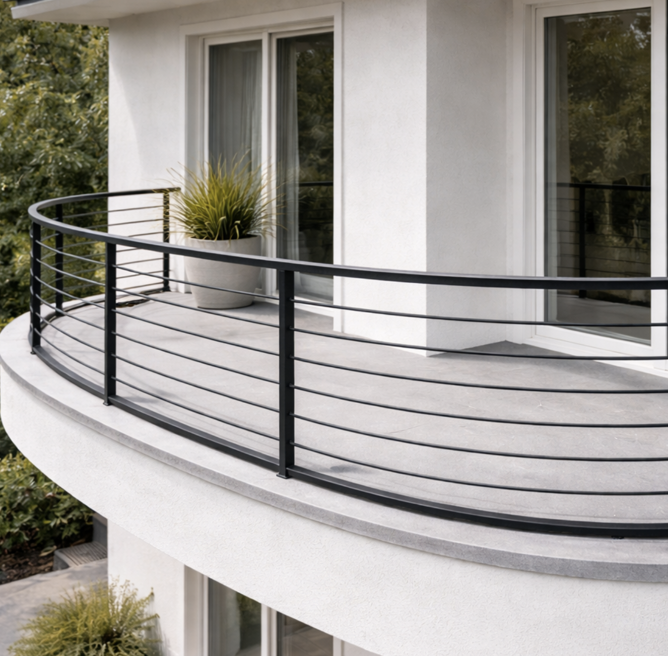 Custom curved metal railing with powder-coated finish on residential balcony