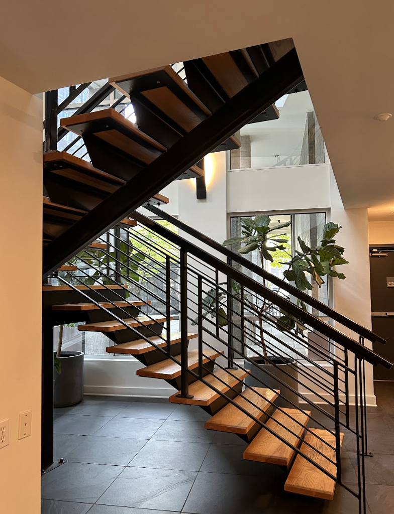 Custom metal staircase with powder-coated steel frame and wood treads