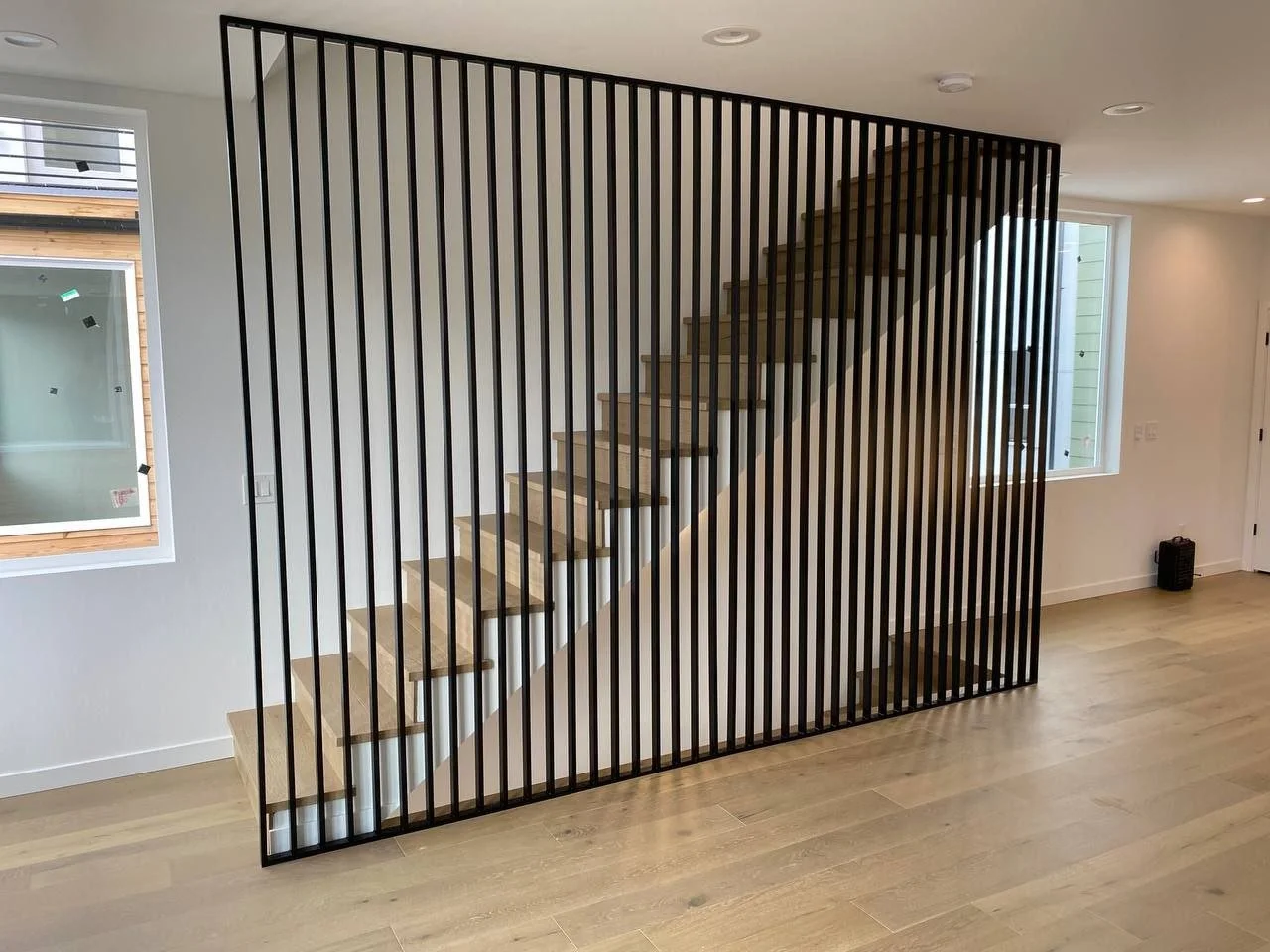 Custom metal divider with architectural design and powder-coated finish