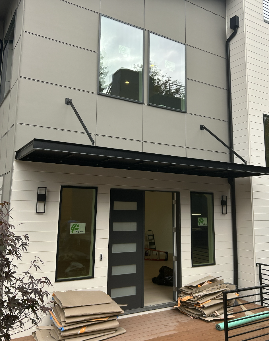 Custom metal entry canopy fabricated from powder-coated steel
