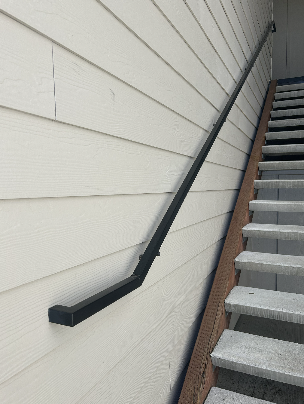 Custom exterior metal railings fabricated from powder-coated steel