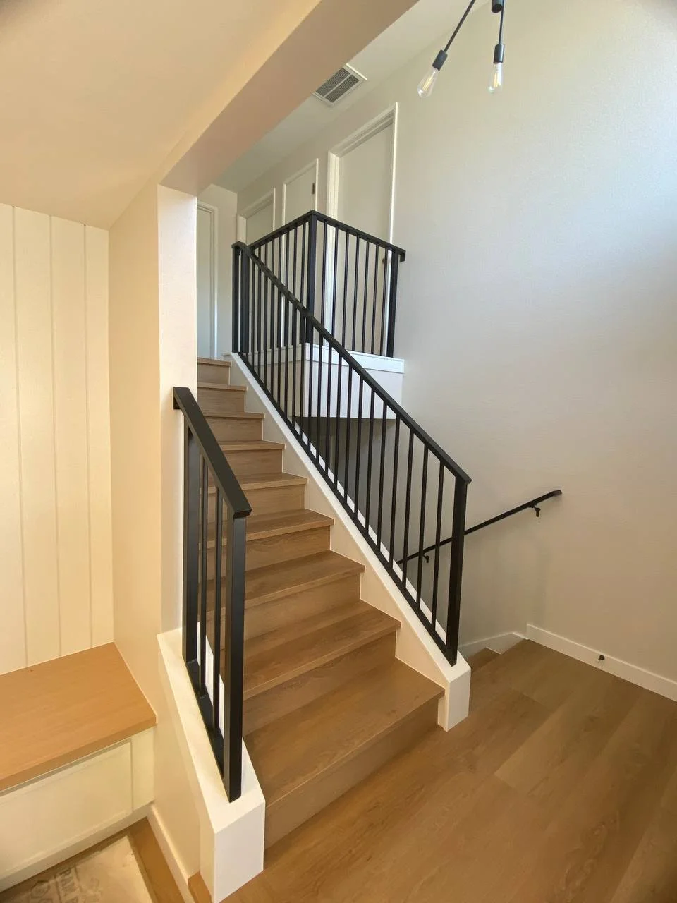 Custom metal handrail for interior staircase with powder-coated finish
