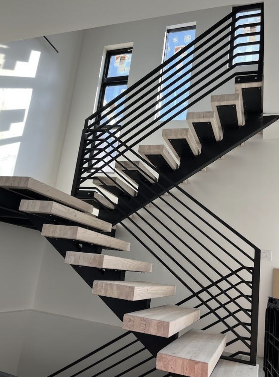 Custom interior metal staircase fabricated and installed in-house