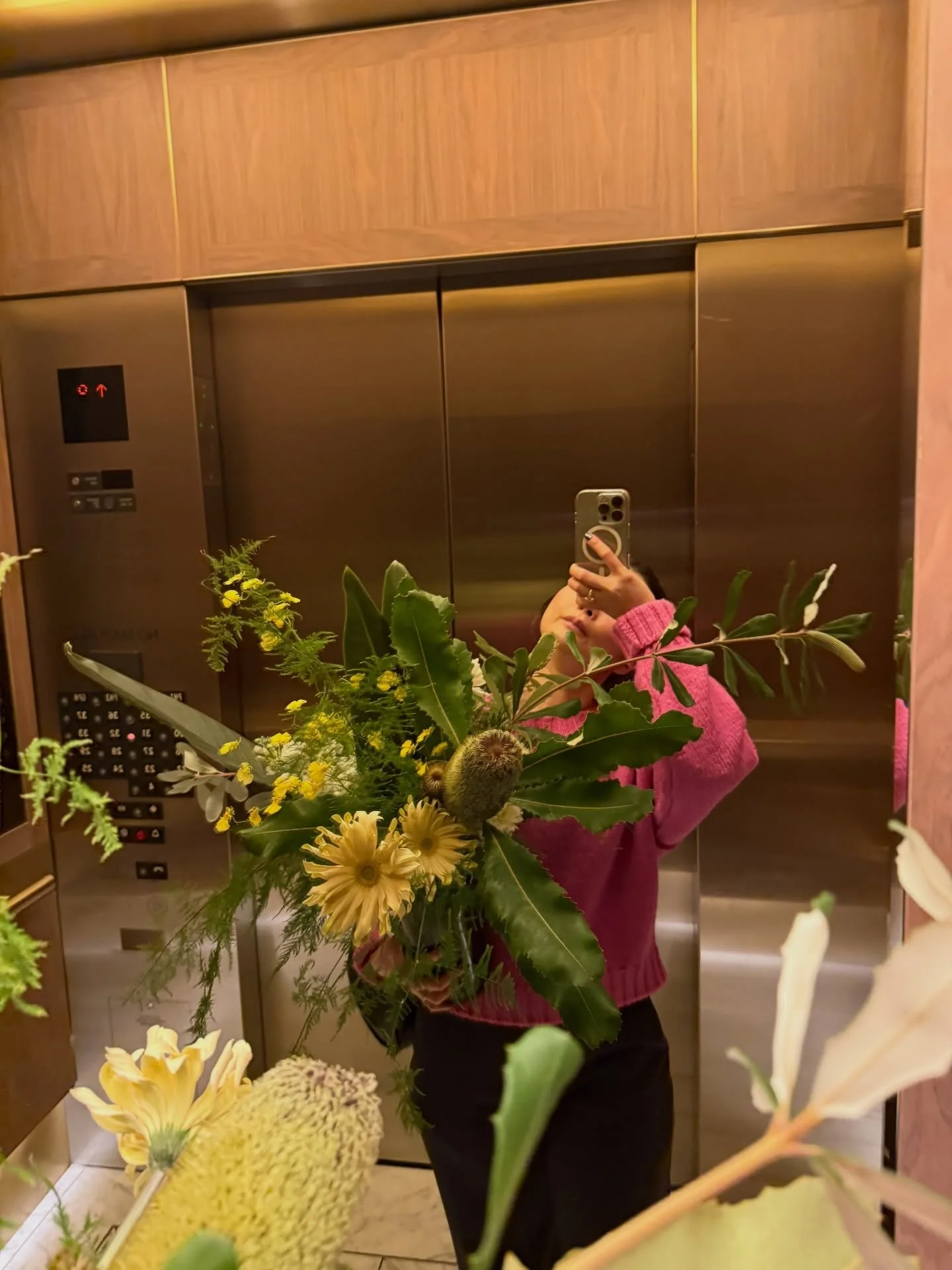 Elevator rides filled with fresh stems and quiet moments before delivery