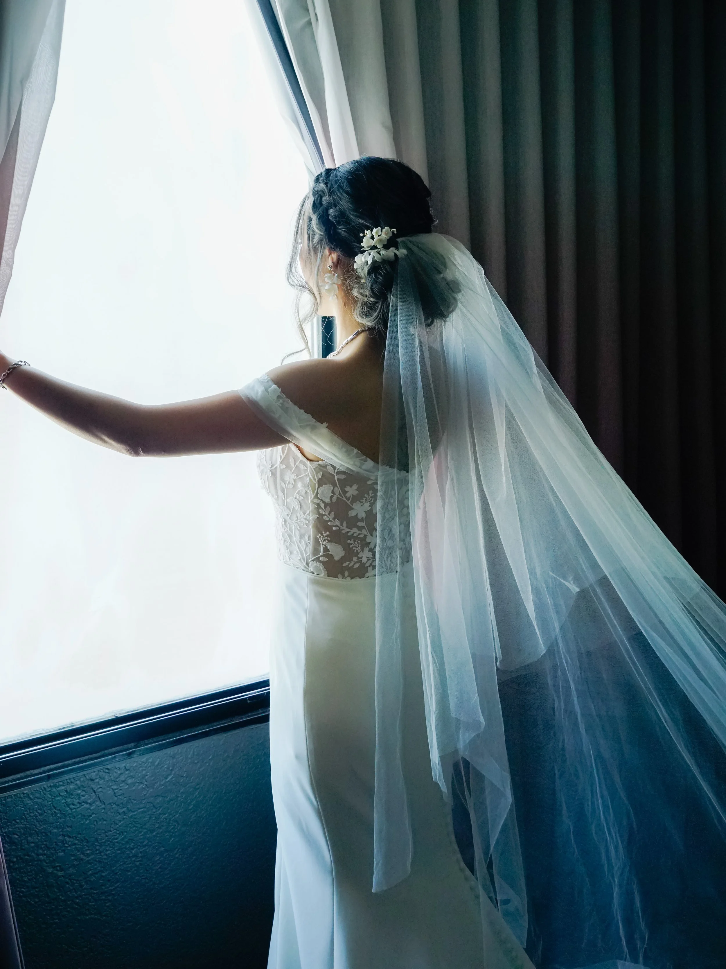 bride at window looking out.jpg