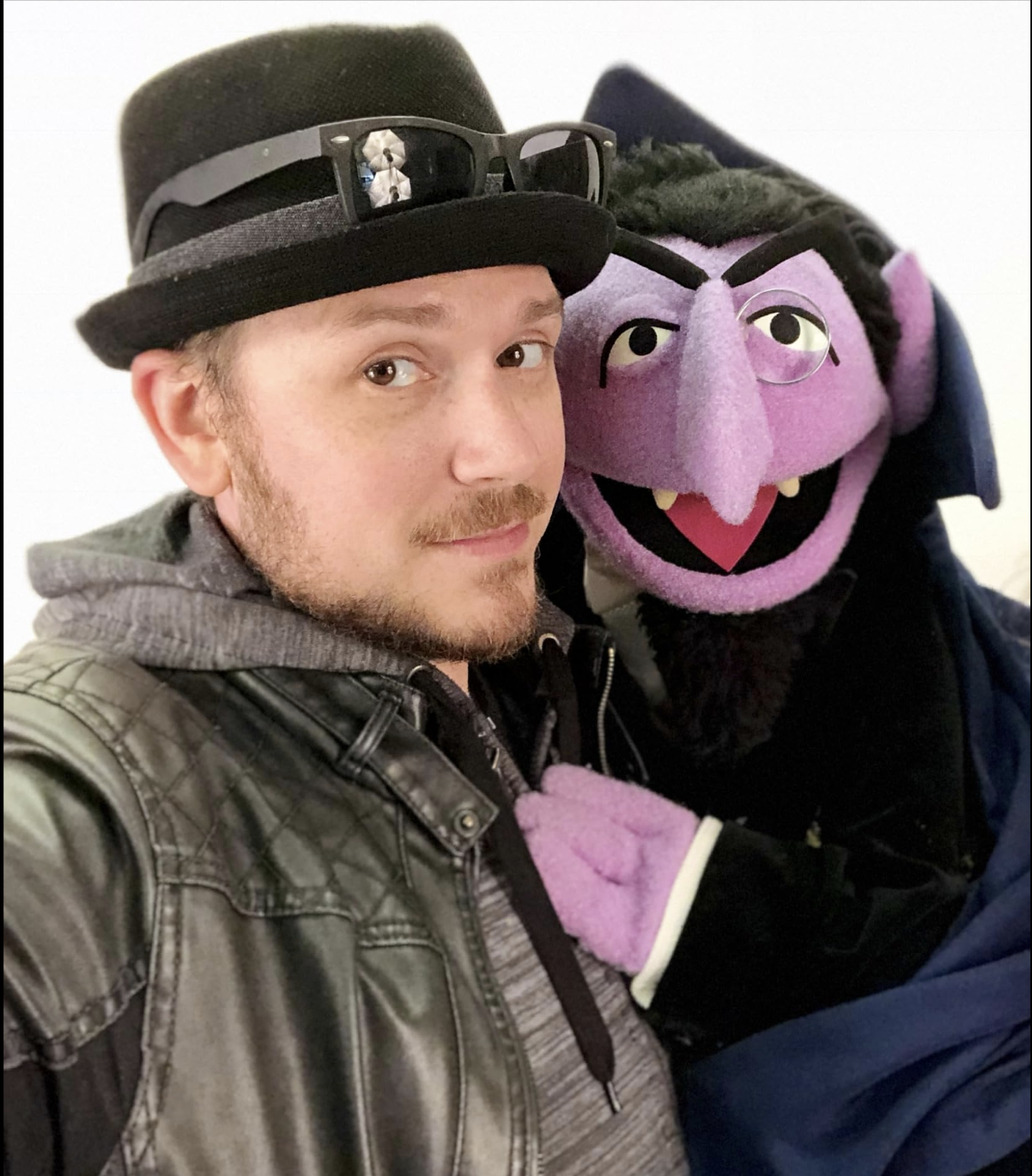 Orlando voice actor and puppeteer Nate Begle posing with a classic vampire character puppet, showcasing his puppetry performance skills and love of character work at Begle Booth Studios.