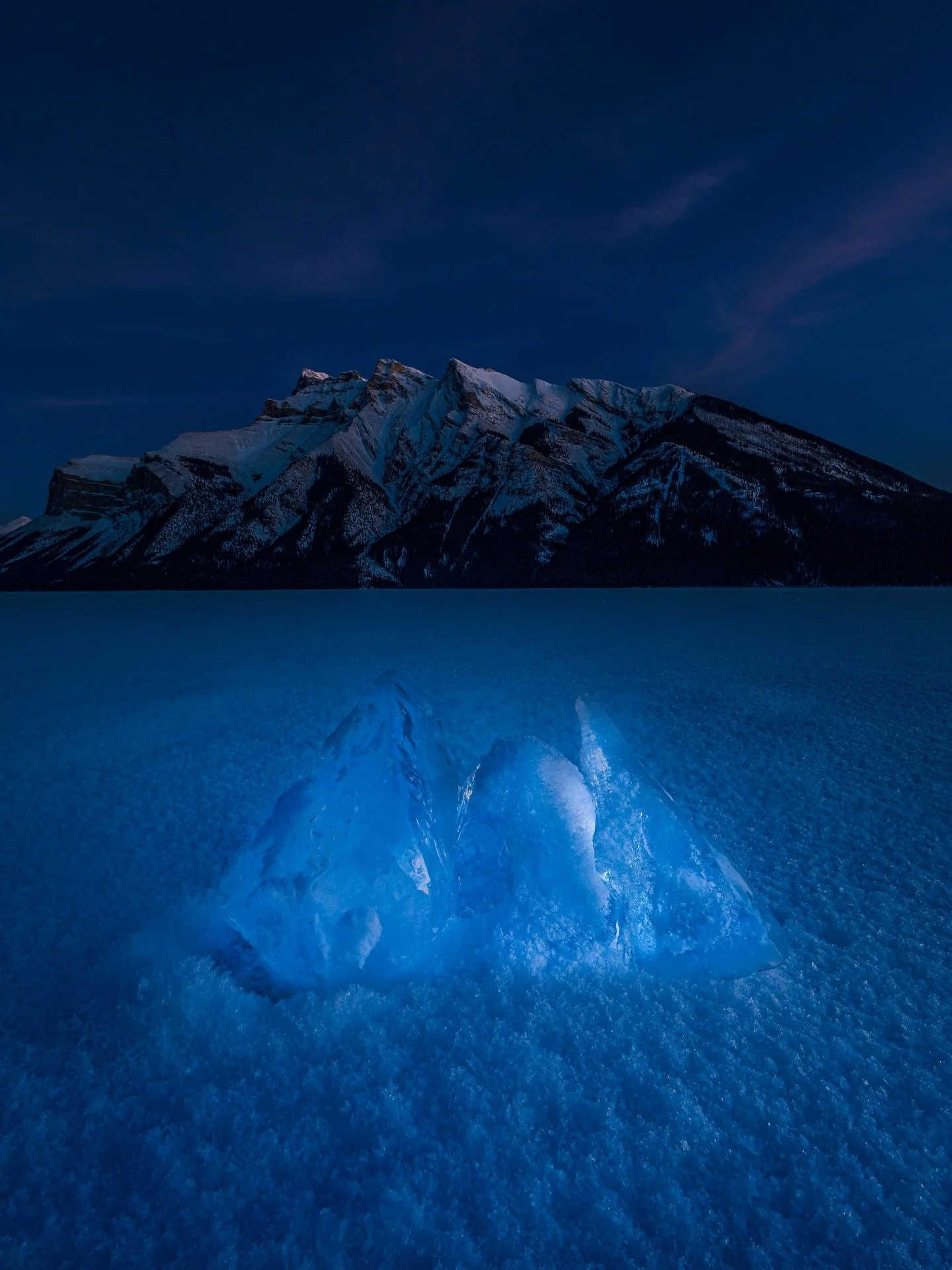 There&rsquo;s nothing that scares you more than the surface of a frozen lake moving under your feet in the dark when you&rsquo;re out there alone. 
On this particular night Minnewanka was yelling so loud you could hear the groans moving down the lake