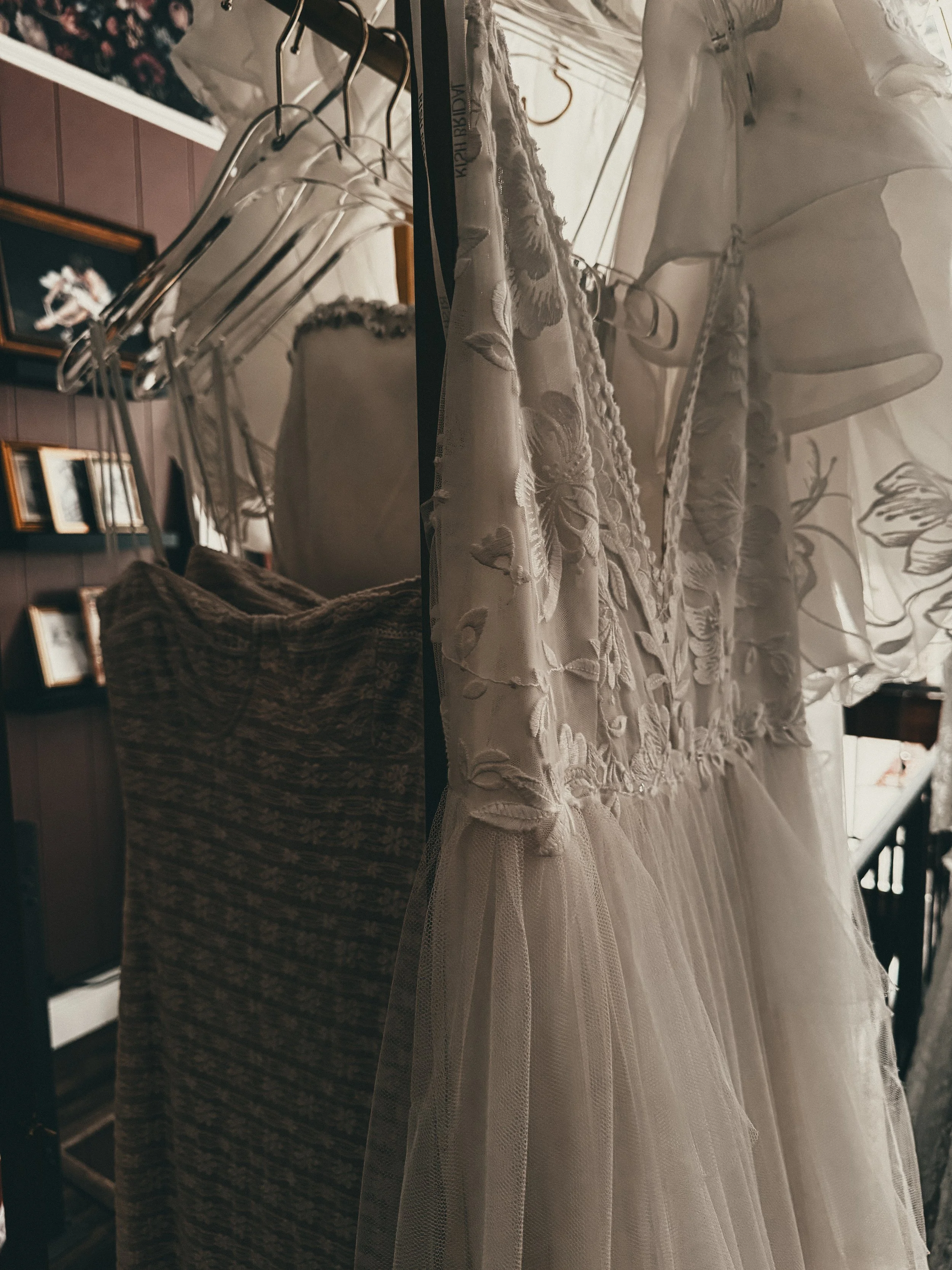 Floral embroidered bodice and flowing tulle skirt on an ethereal dreamer bridal gown at Art & Lace Bridal, MA.