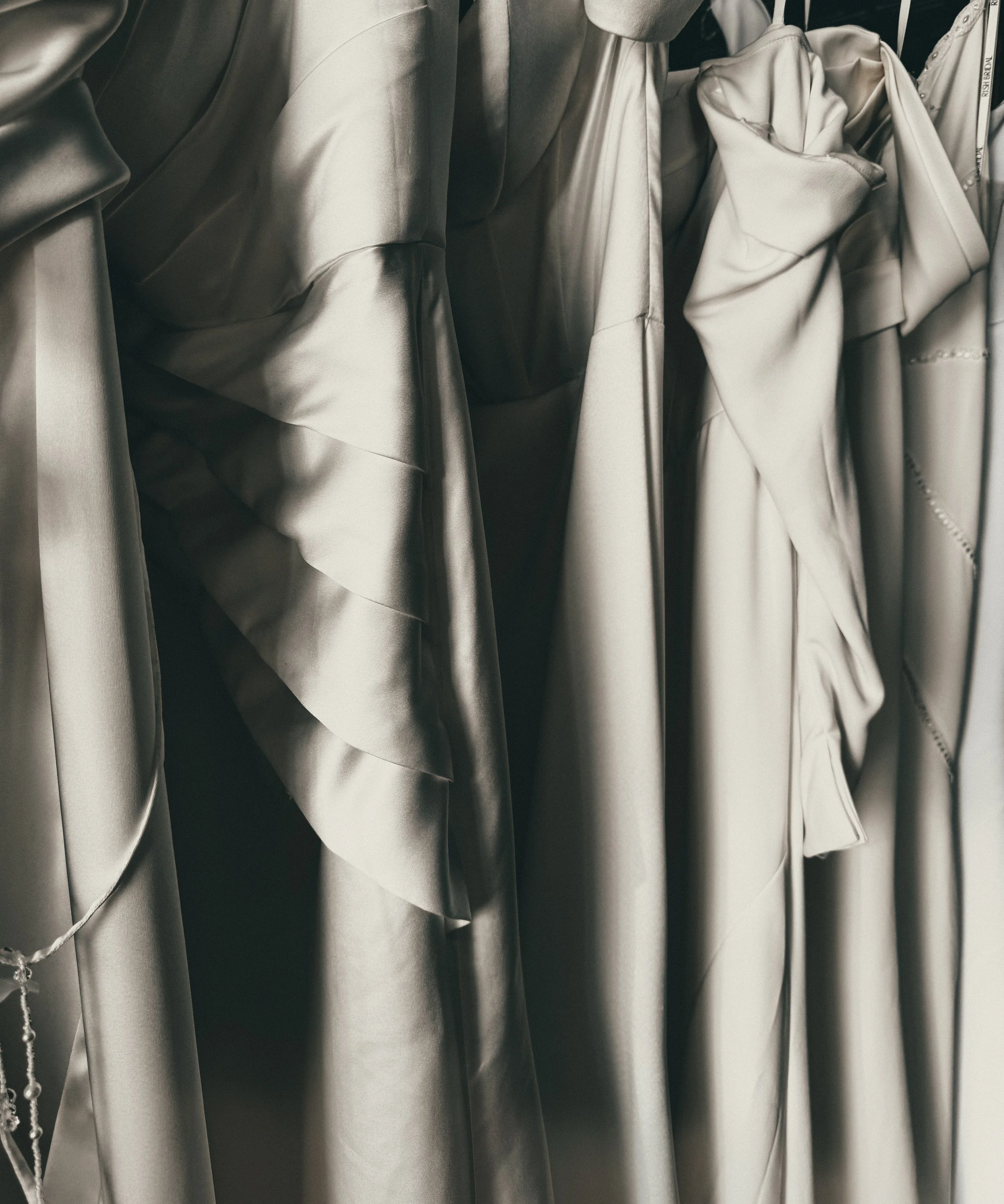 Softly pleated silk fabric close-up on a minimalist bridal gown at Art & Lace Bridal, MA/RI border studio.
