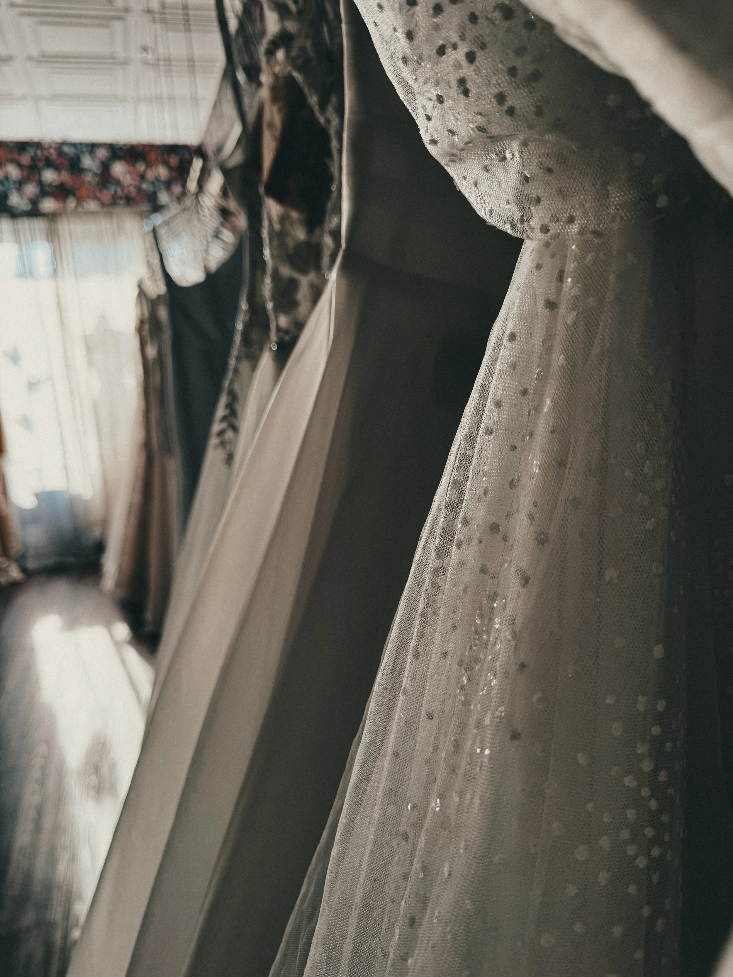 Pearl-dotted tulle veil and flowing ivory gown in the Ethereal Dreamer zone at Art & Lace Bridal.
