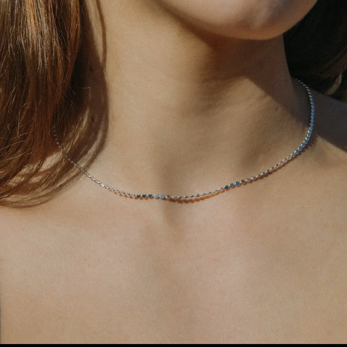 Anatole Silver Choker worn at the collarbone with soft daylight — a minimalist bridal accent