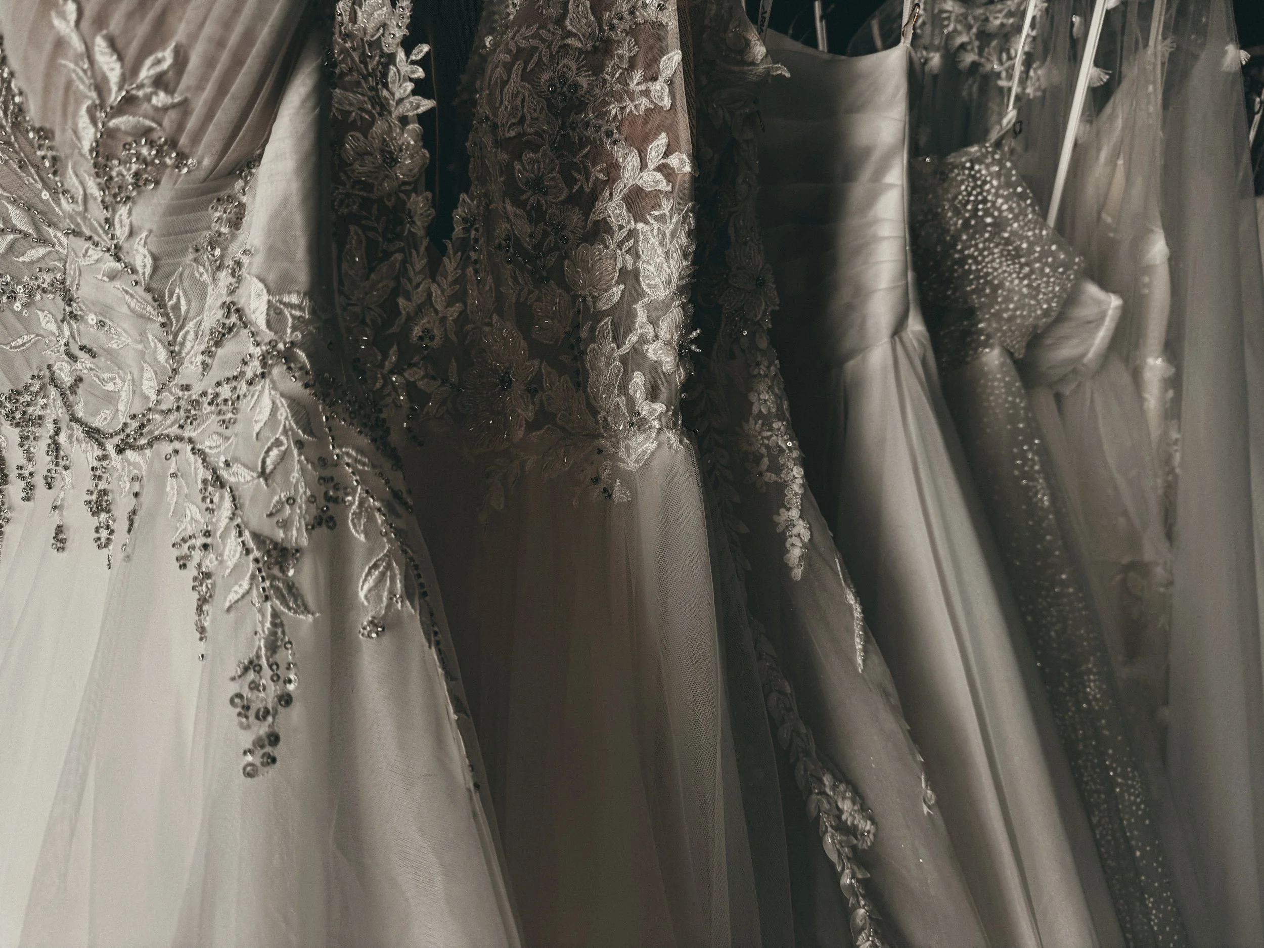 Silver beaded leaf embroidery on tulle skirt of an ethereal wedding gown at Art & Lace Bridal in Somerset, MA.