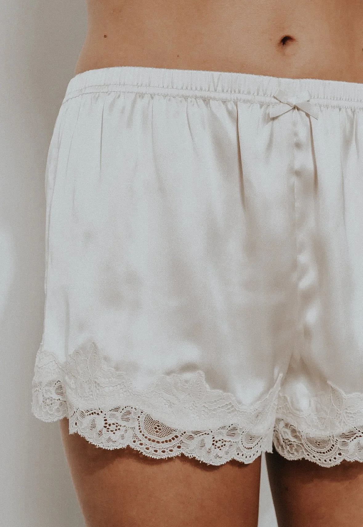 Close Up of Isla Lace Trim Satin Shorts.jpg