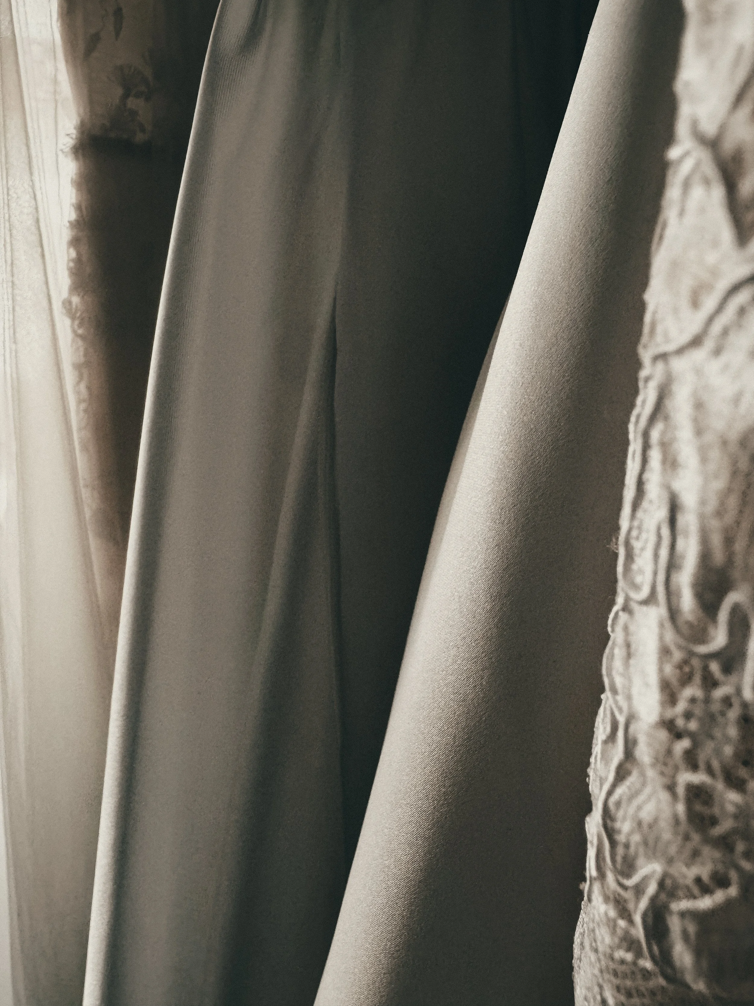 Sculpted silk crepe fabric drape on a modern minimalist wedding gown at Art & Lace Bridal in Somerset, MA.