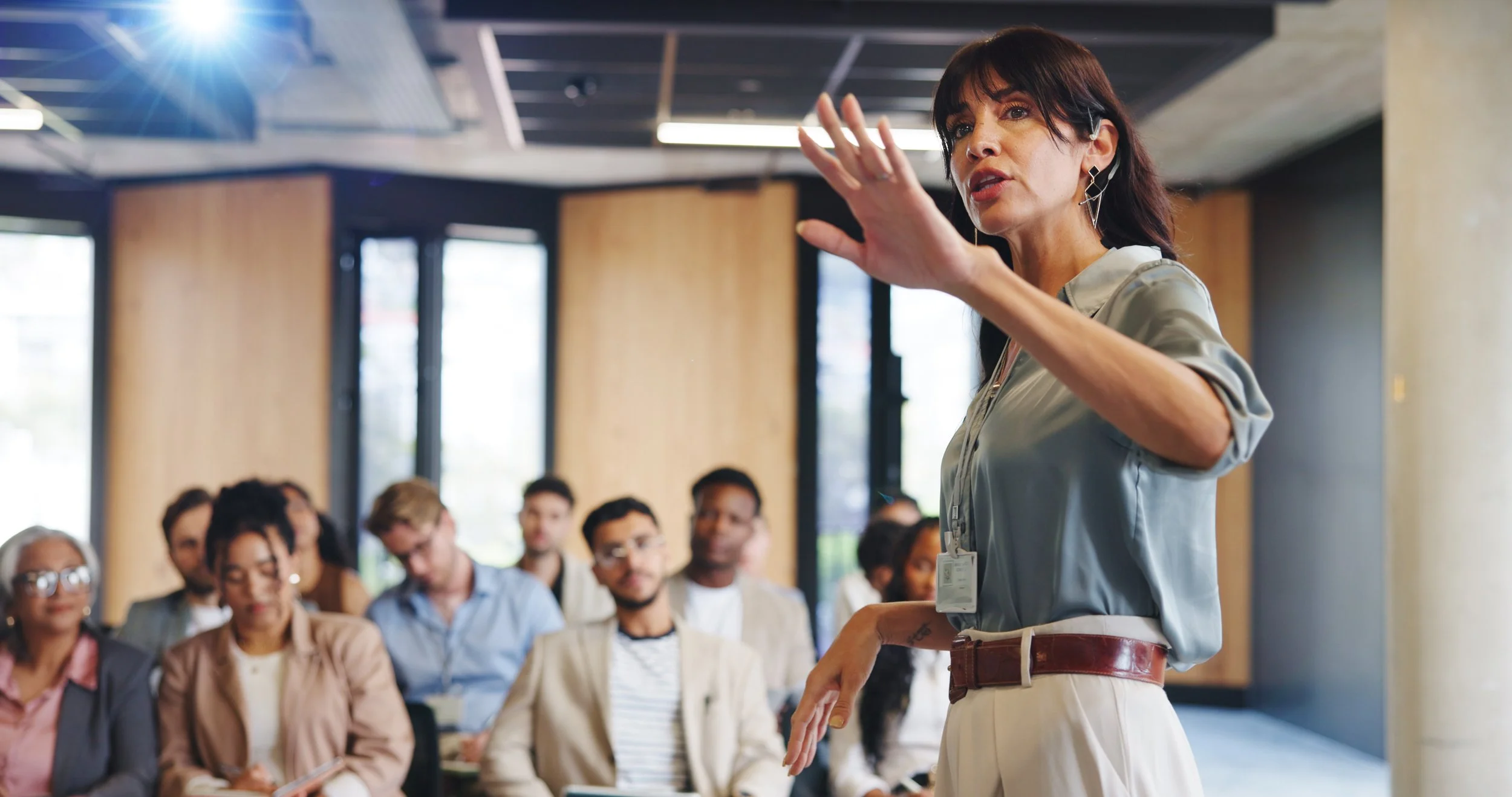 woman presenting to an audience