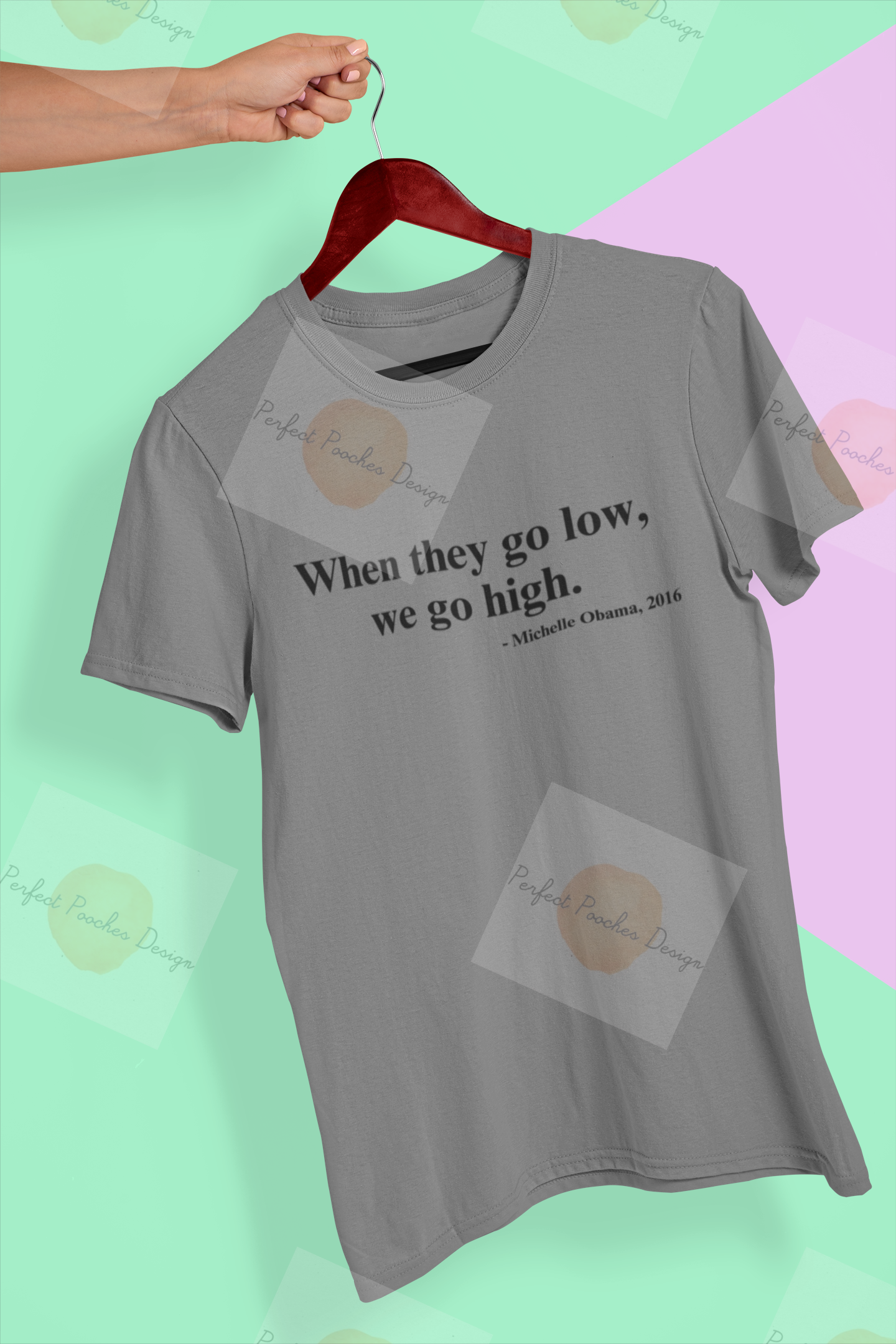 mockup-of-a-hand-holding-a-t-shirt-in-a-colorful-background-26735.png