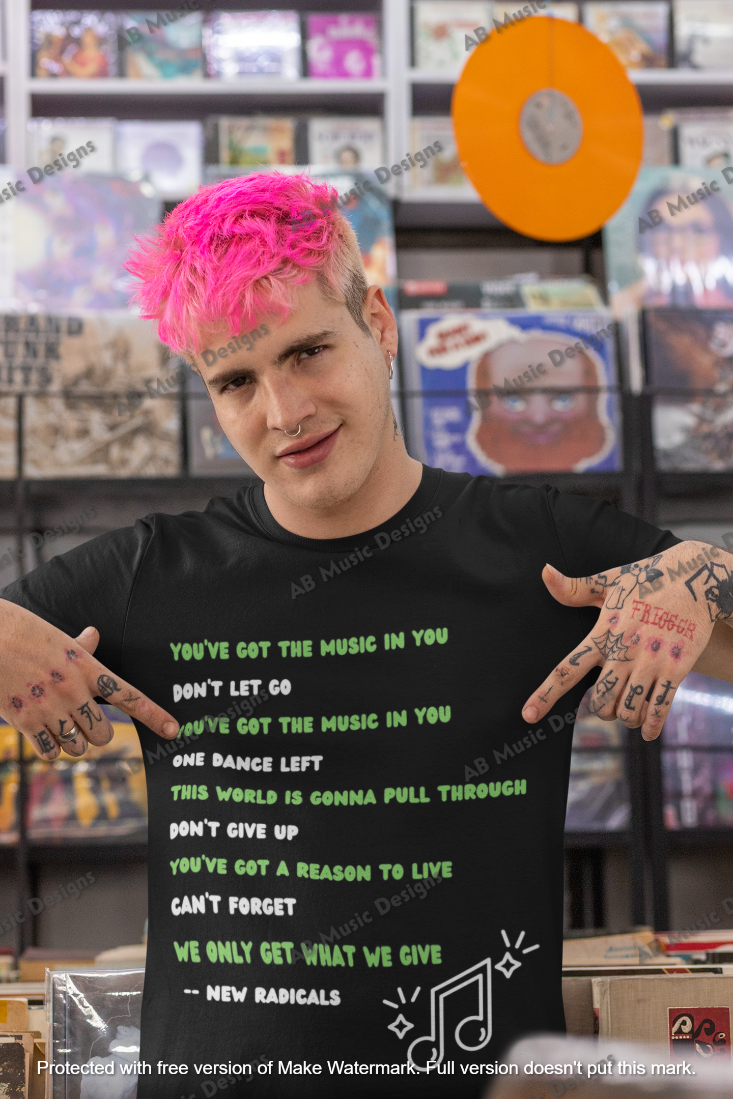 mockup-of-a-man-at-a-record-store-pointing-at-his-t-shirt-33309.png