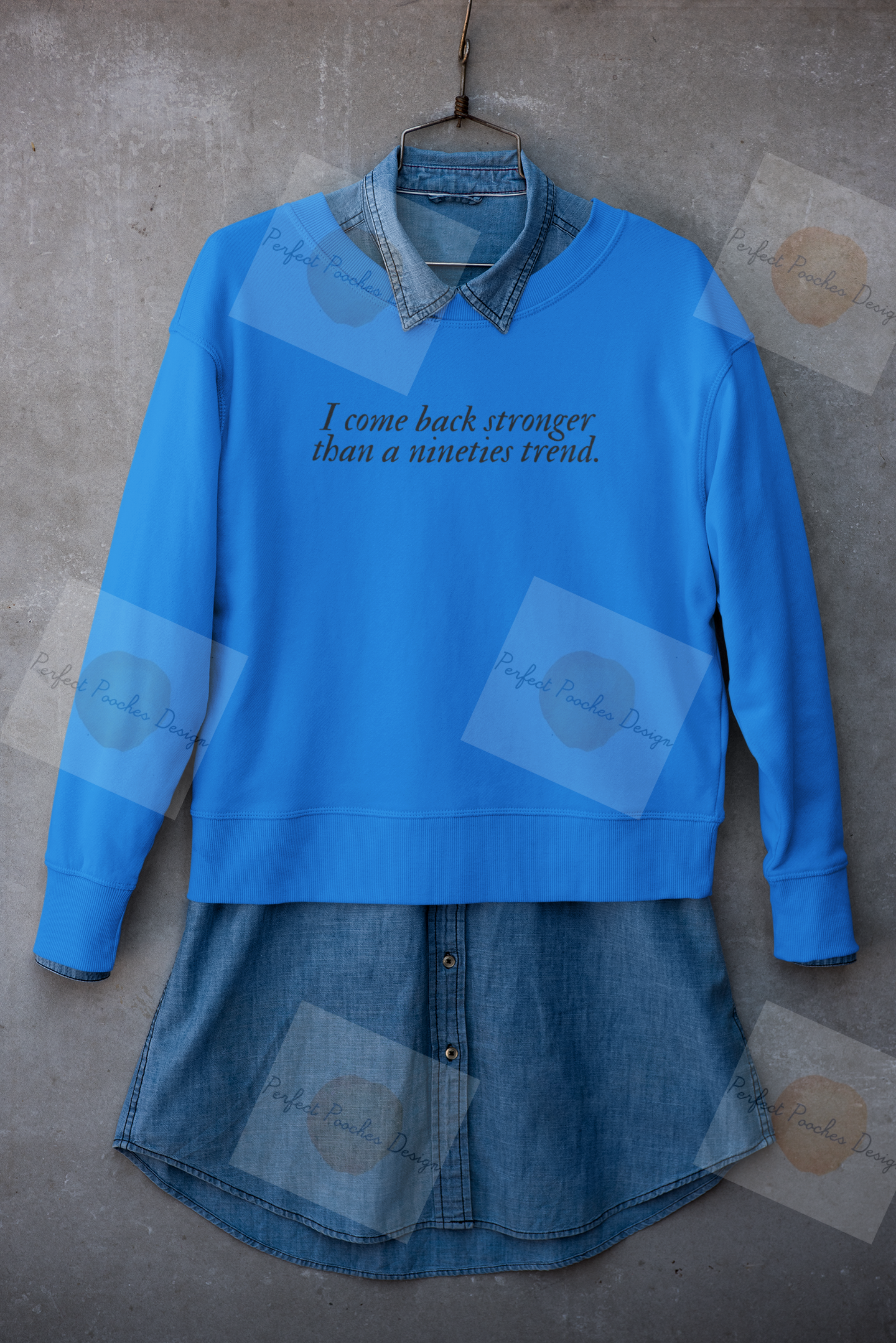 mockup-of-a-crewneck-sweatshirt-placed-on-a-hanger-with-a-denim-garment-33981.png