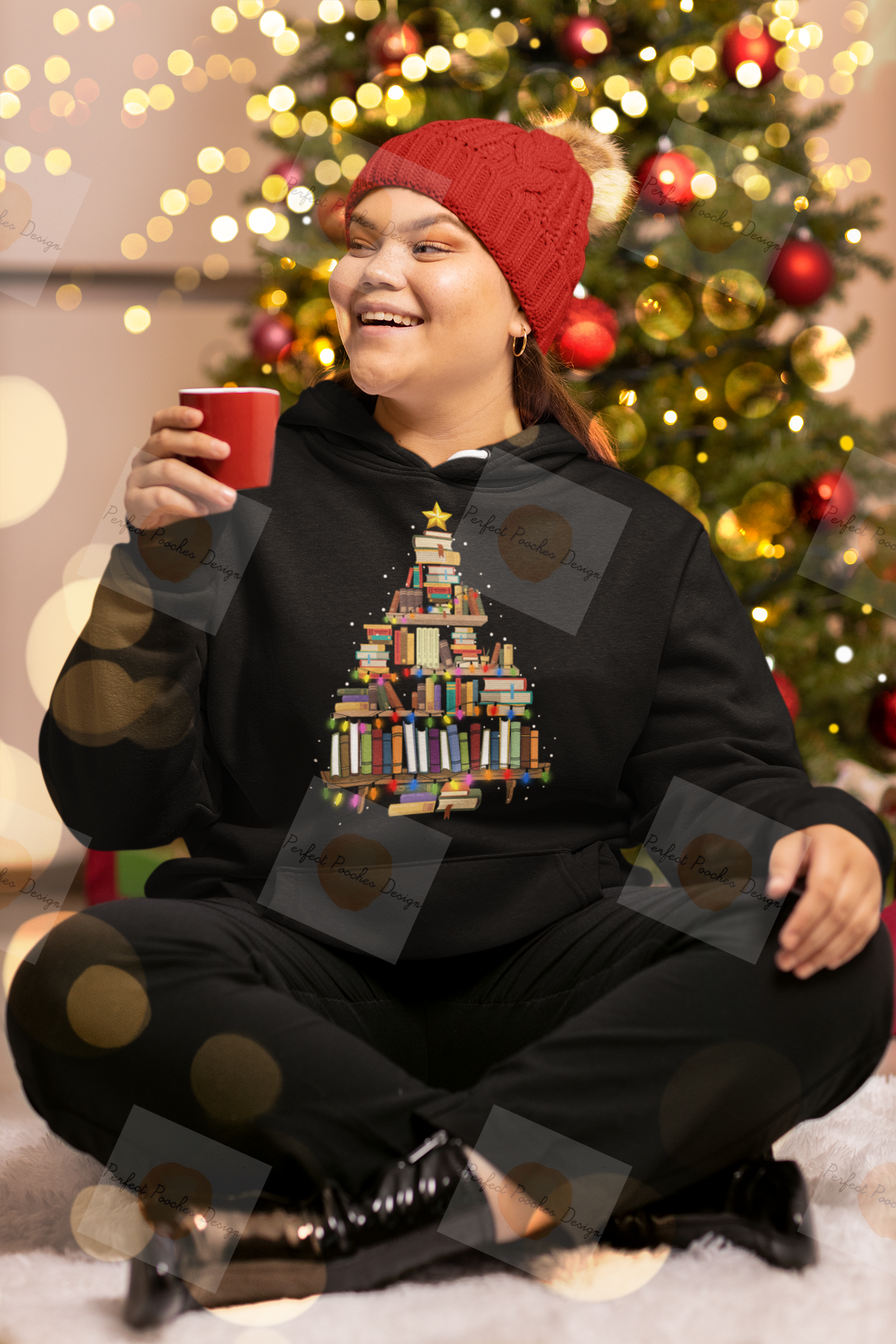 pullover-hoodie-mockup-of-a-smiling-woman-sitting-by-a-christmas-tree-m30410.png