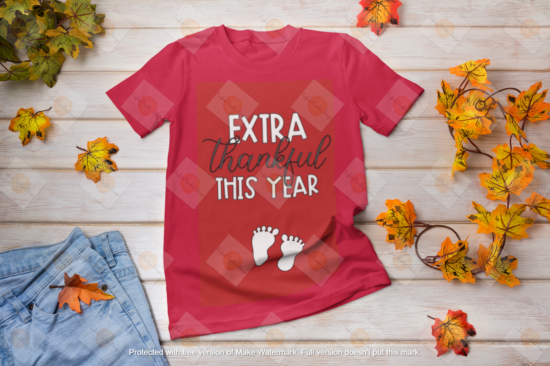 mockup-featuring-a-t-shirt-and-fall-leaves-placed-on-a-wooden-table-41383-r-el2.png