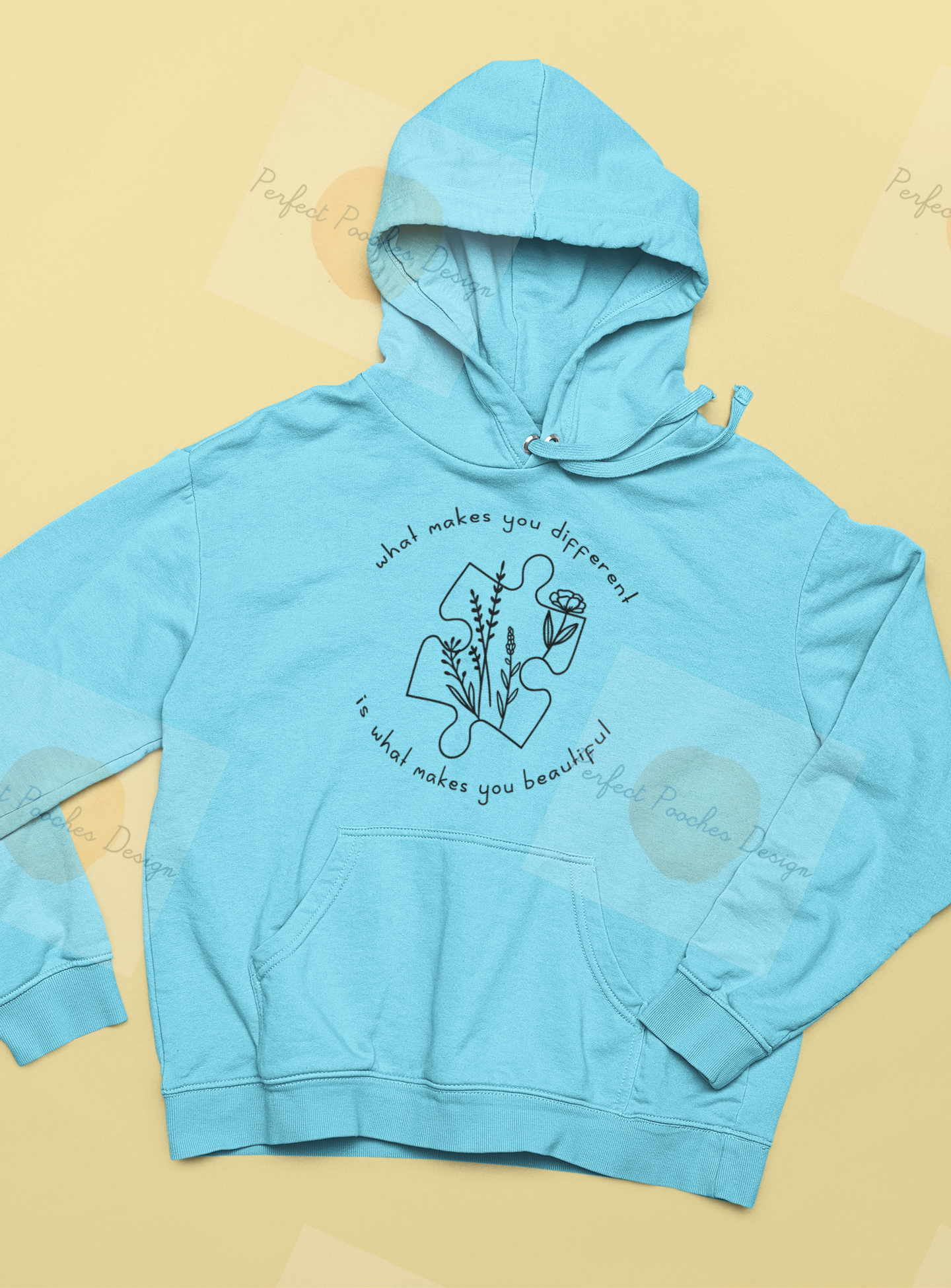 mockup-of-a-pullover-hoodie-lying-over-a-flat-surface-33901.png