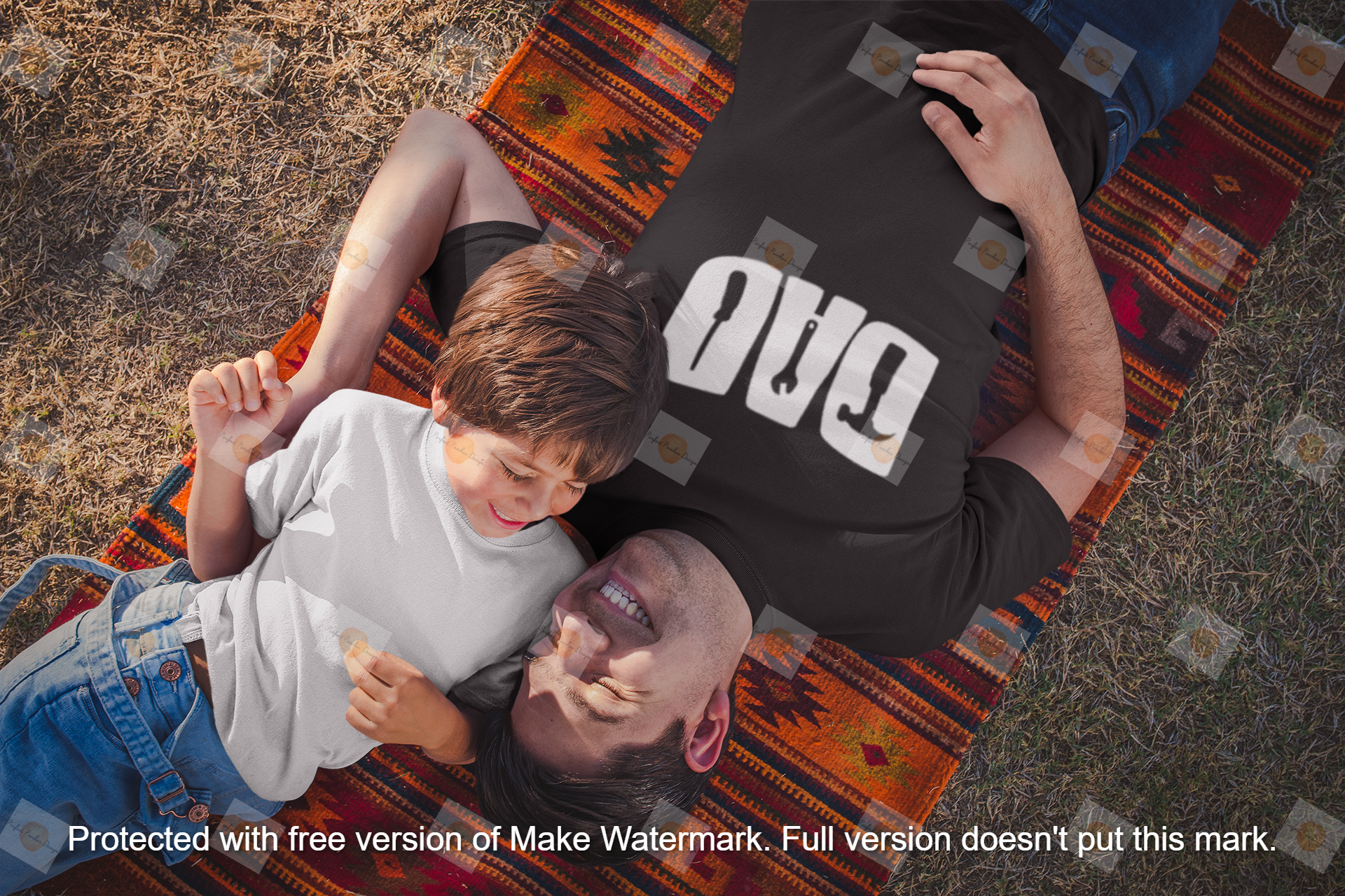 dad-and-boy-wearing-t-shirts-mockup-lying-down-at-the-park-a20190.png