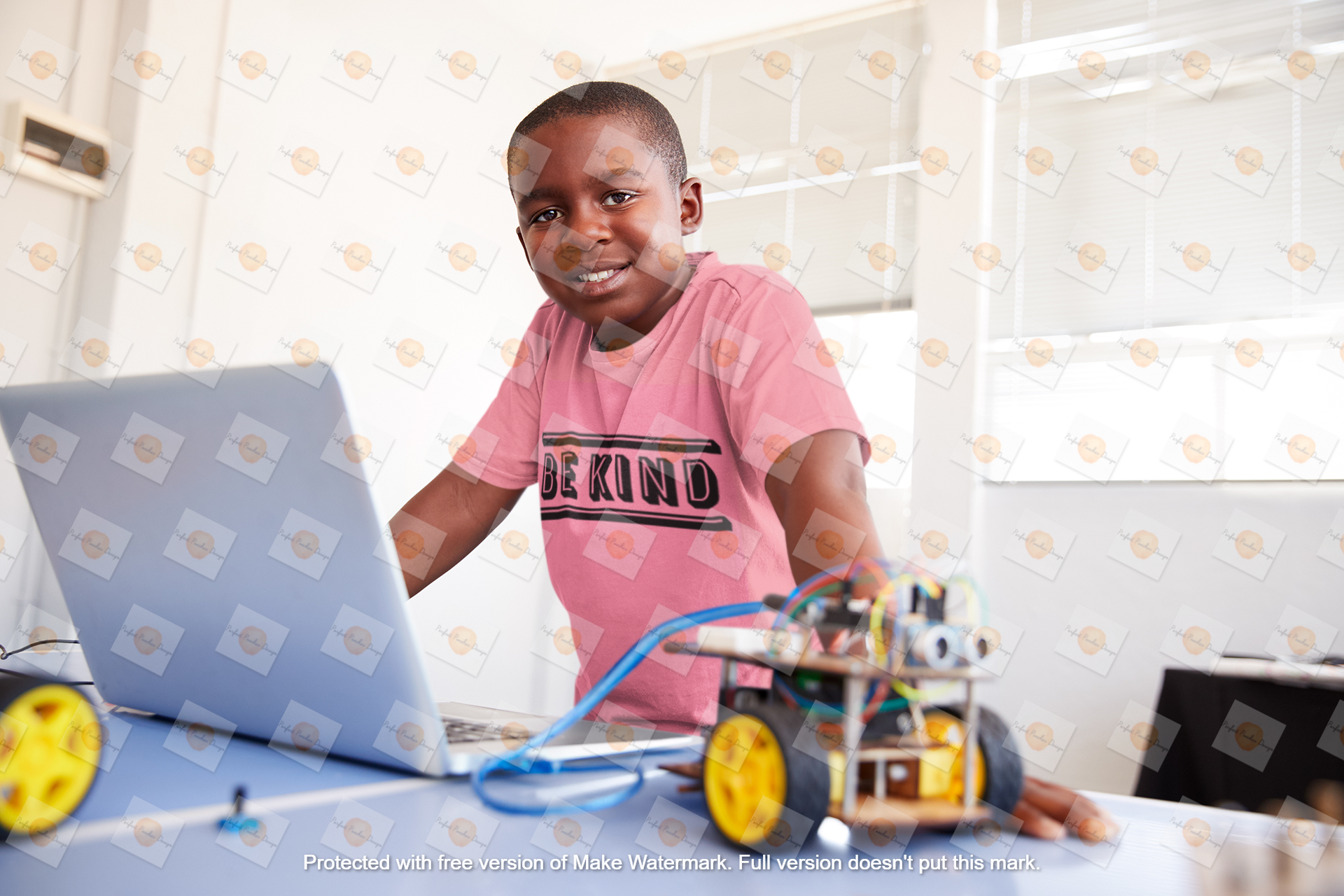 tee-mockup-of-a-smiling-boy-at-a-robotics-classroom-39226-r-el2.png