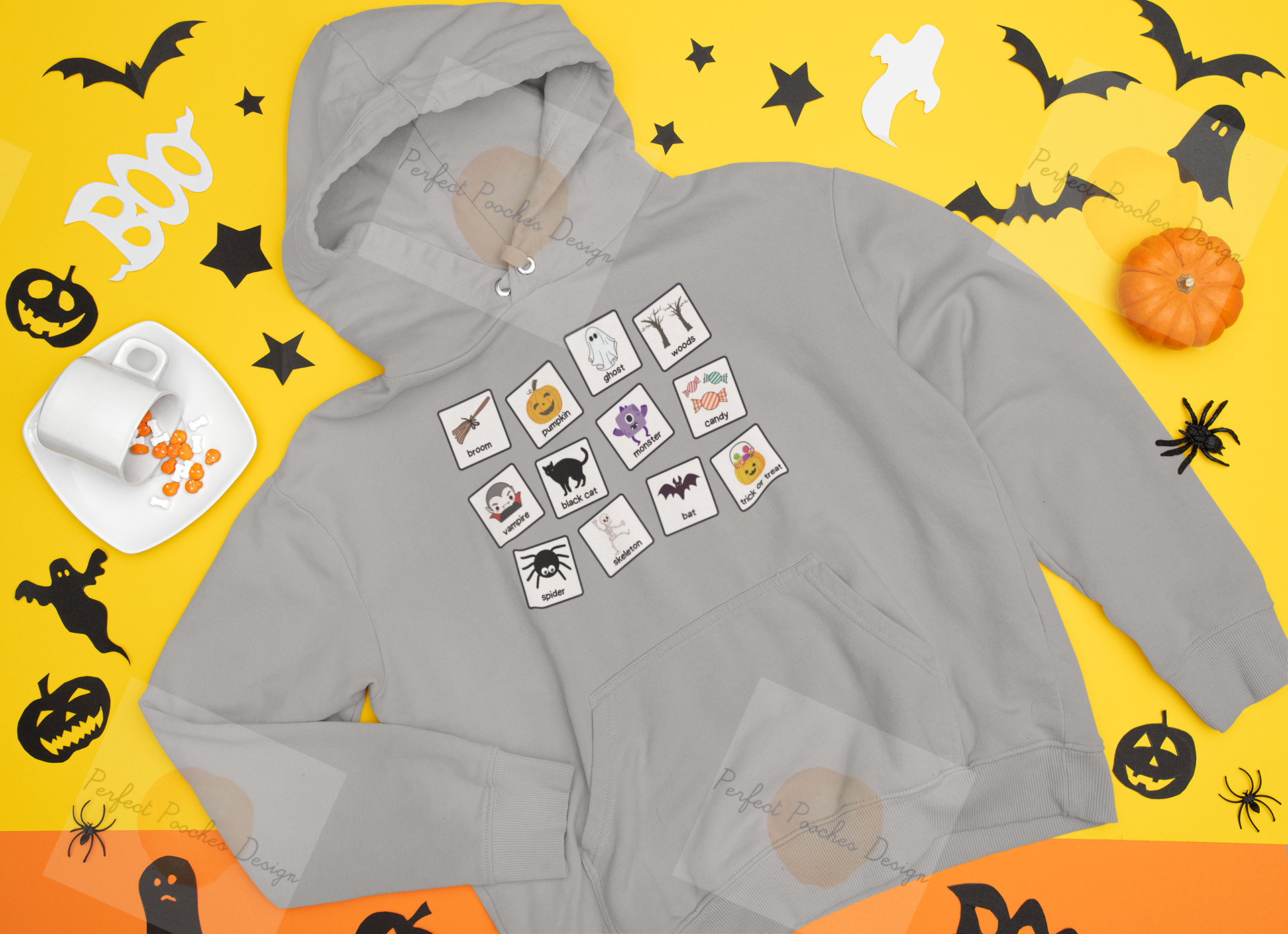 mockup-of-a-flat-laid-pullover-hoodie-surrounded-by-halloween-decor-m90.png