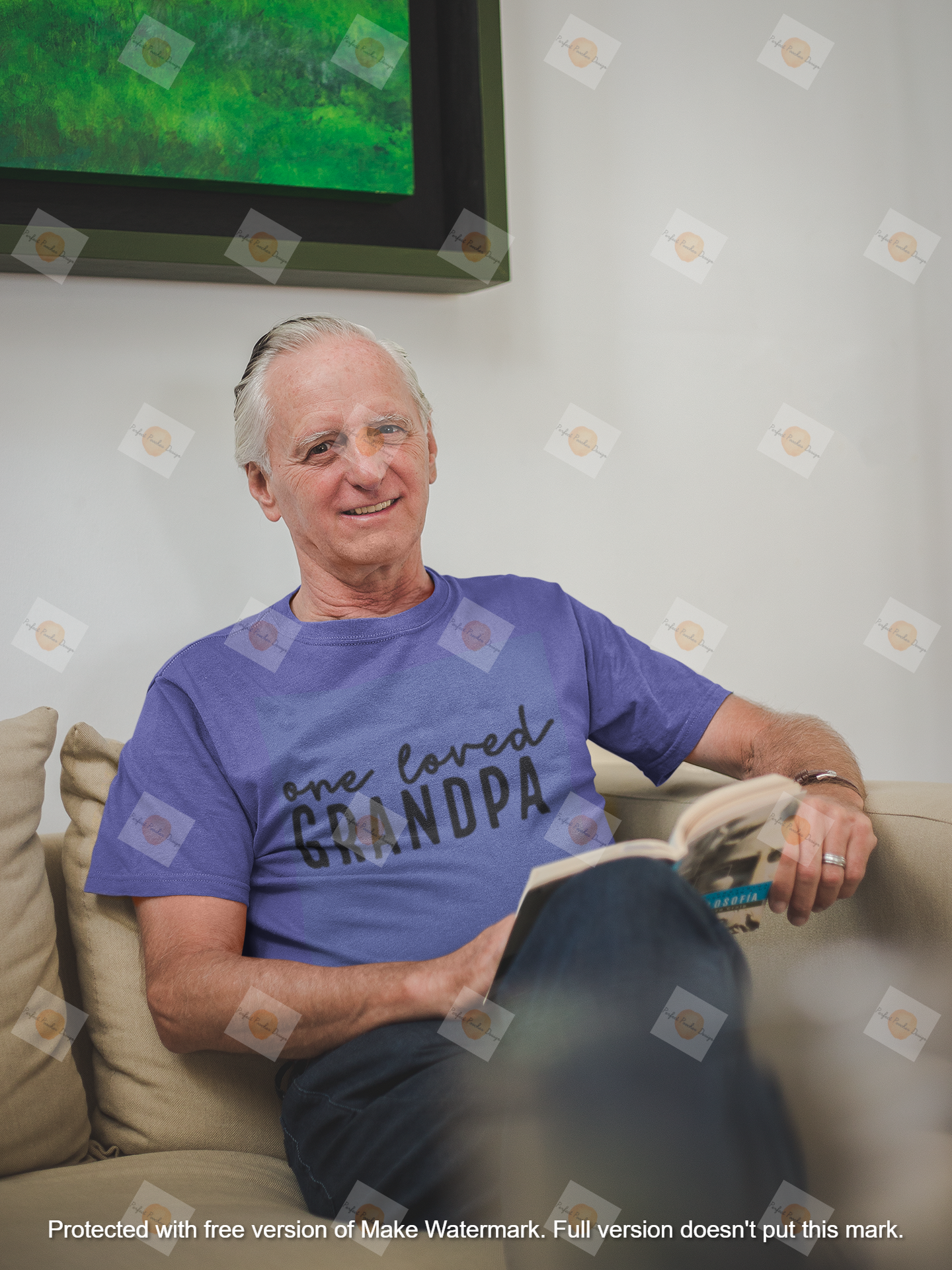 senior-man-wearing-a-t-shirt-mockup-reading-a-book-sitting-on-the-sofa-a20504.png