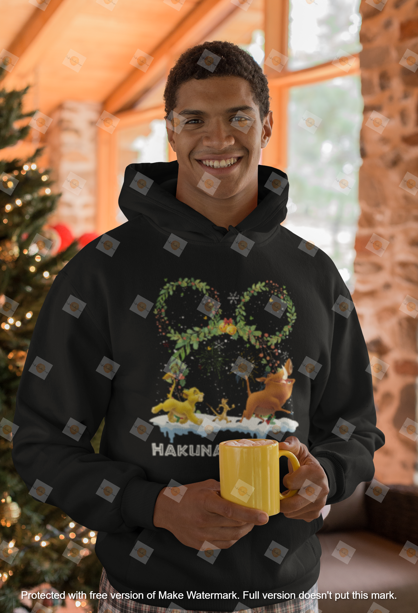 mockup-of-a-man-wearing-a-hoodie-in-front-of-a-christmas-tree-23507.png