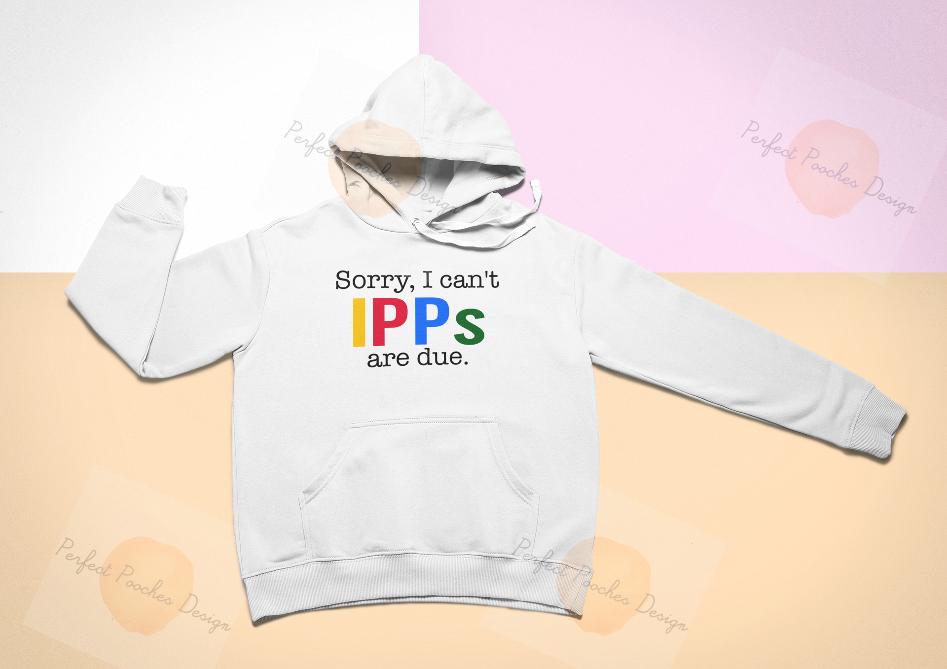 mockup-of-a-pullover-hoodie-lying-flat-on-a-colorful-surface-24758.png