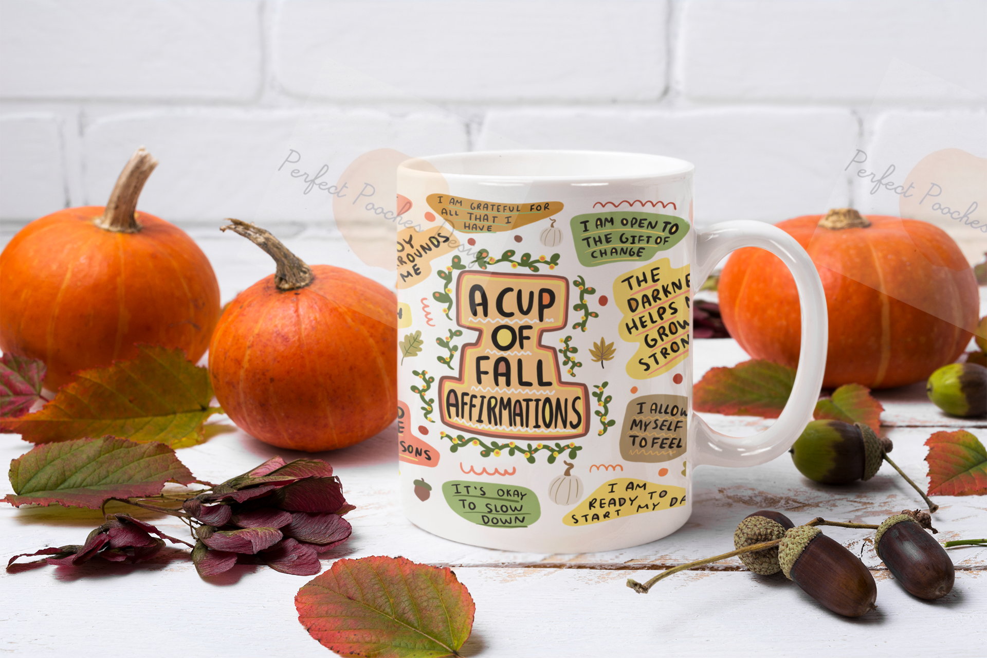 mockup-featuring-an-11-oz-mug-surrounded-by-pumpkins-37284-r-el2.png