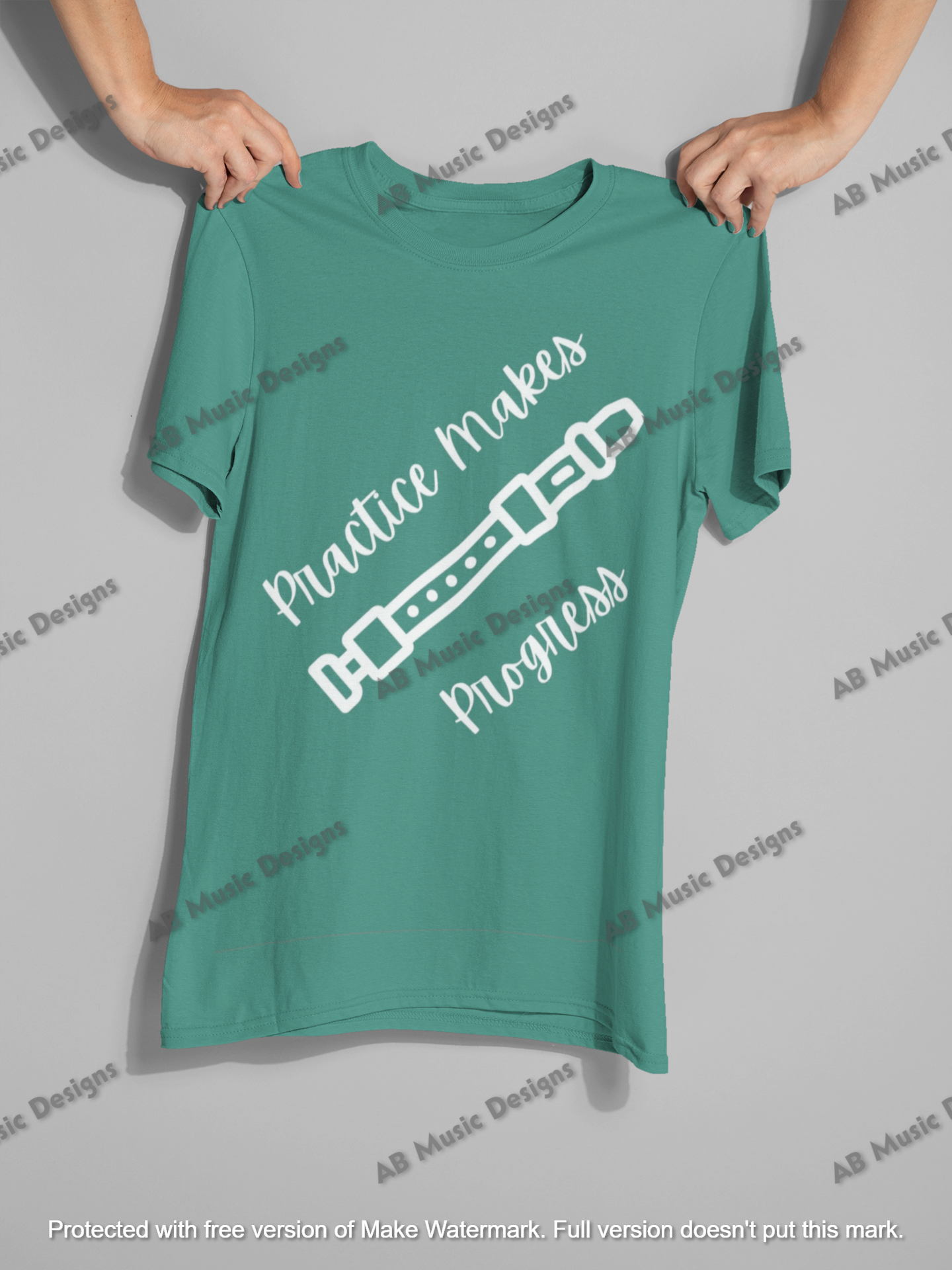 mockup-of-two-hands-holding-a-t-shirt-26737.png
