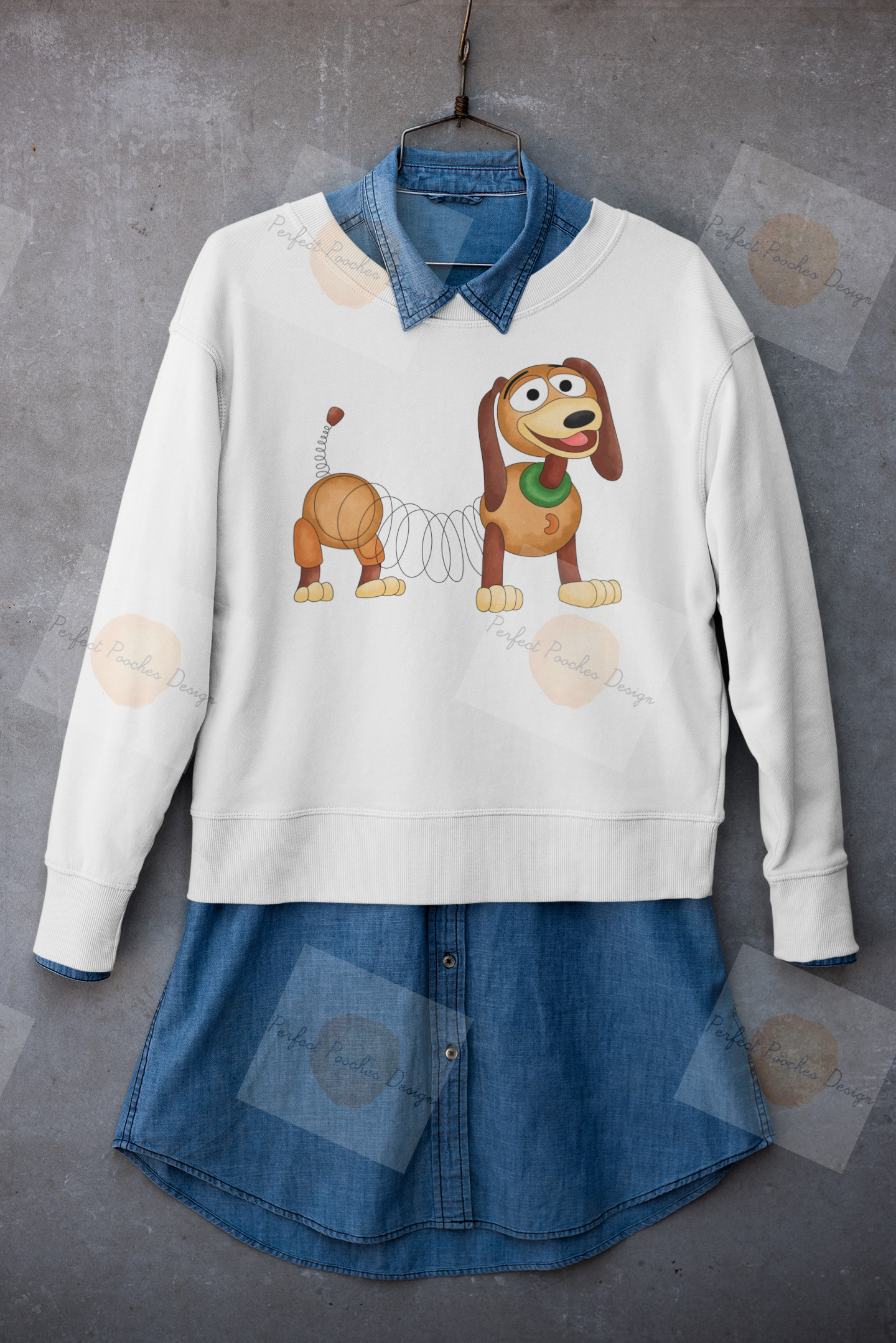 mockup-of-a-crewneck-sweatshirt-placed-on-a-hanger-with-a-denim-garment-33981.png
