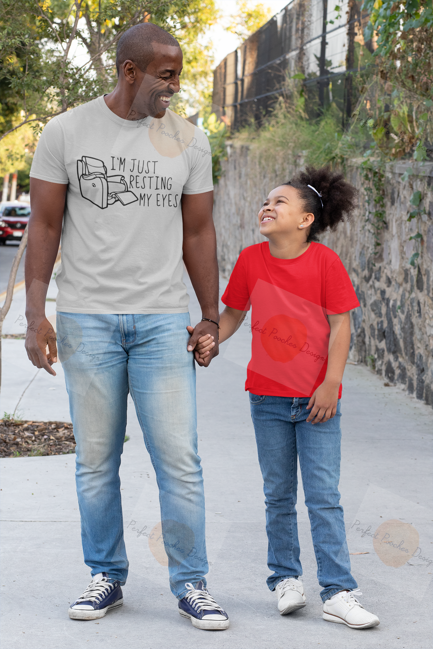 mockup-of-a-dad-and-his-child-wearing-t-shirts-on-the-street-31392.png