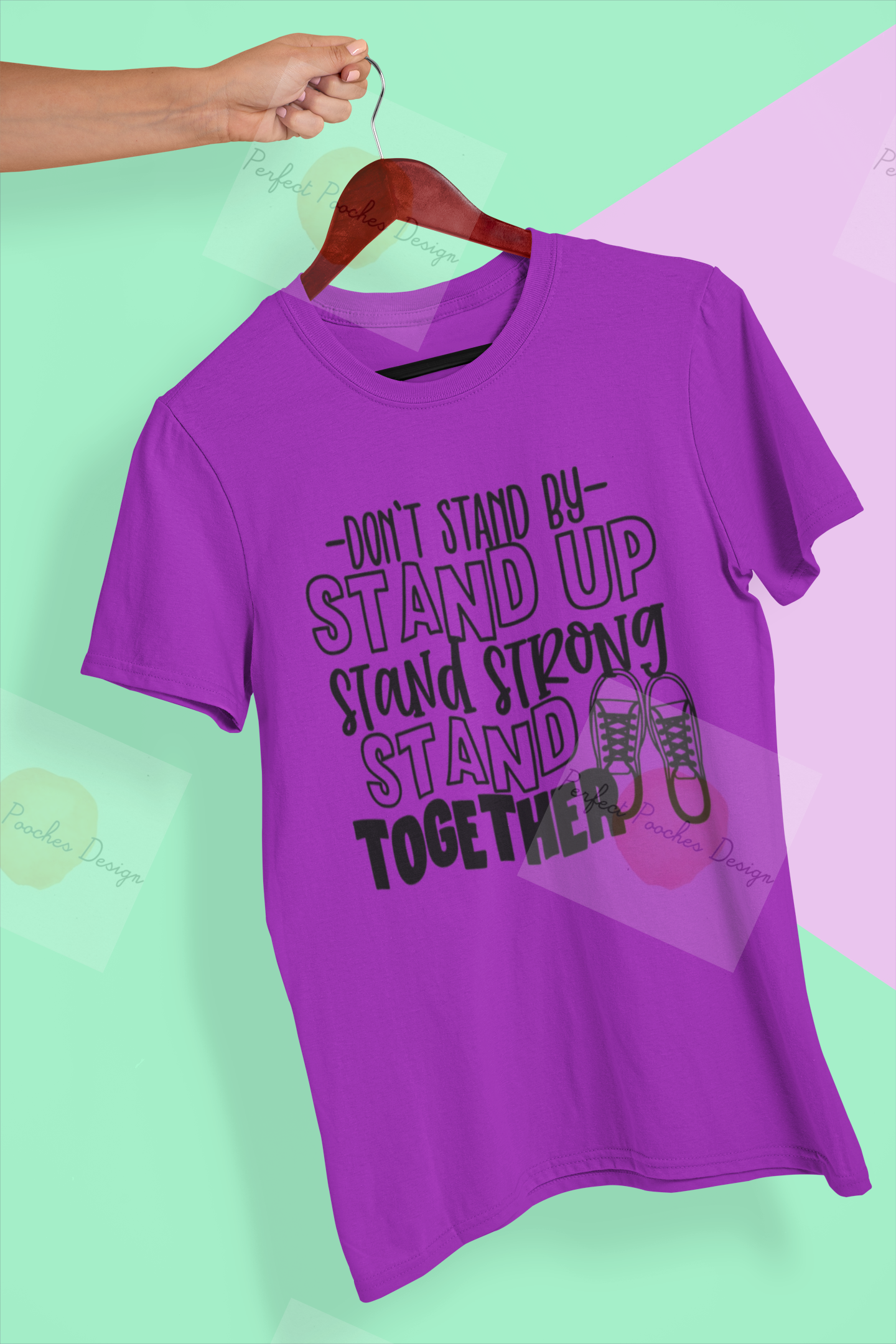 mockup-of-a-hand-holding-a-t-shirt-in-a-colorful-background-26735.png