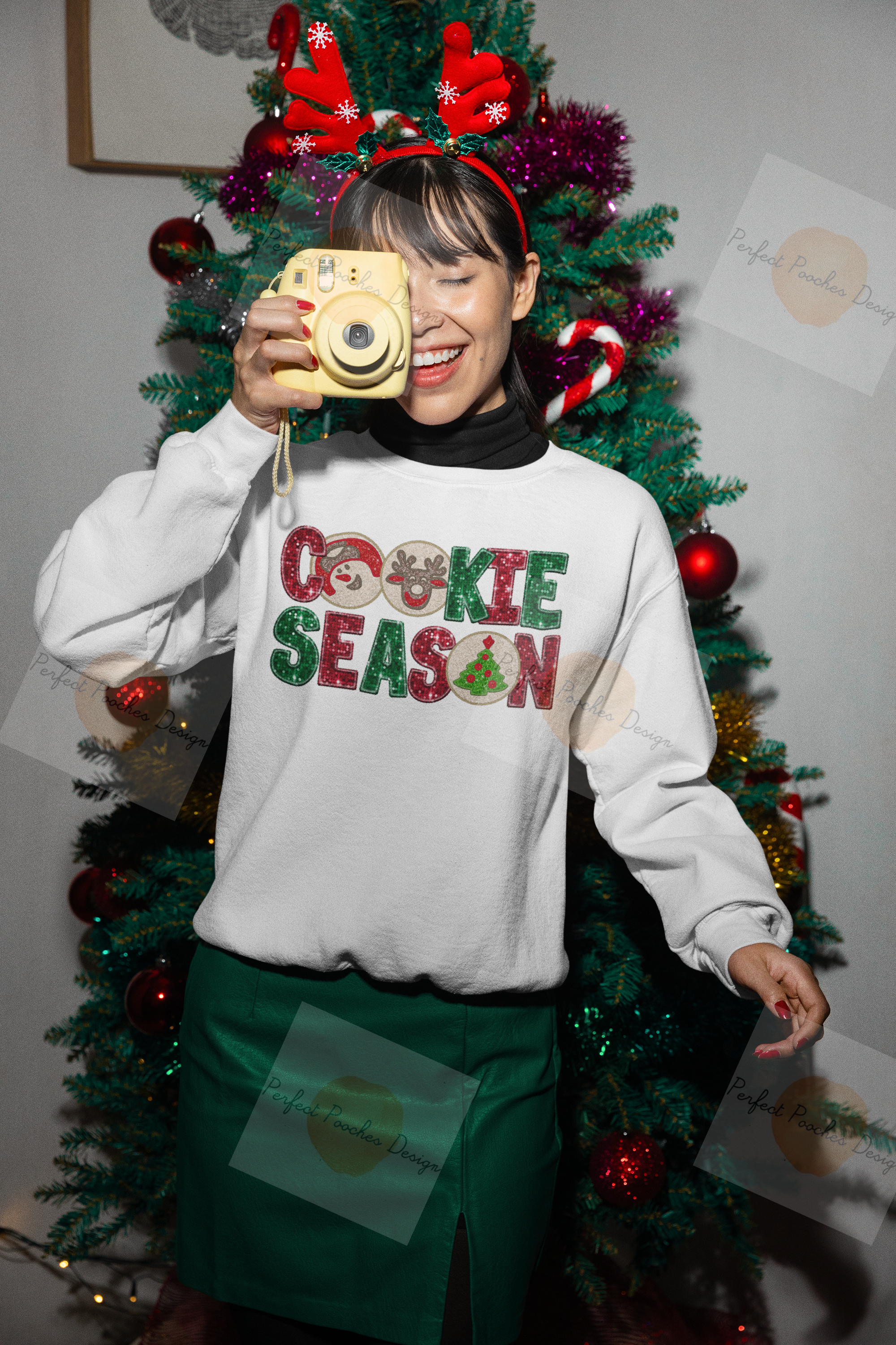 xmas-themed-gildan-sweatshirt-mockup-of-a-woman-taking-a-picture-with-an-instant-camera-m35927.png