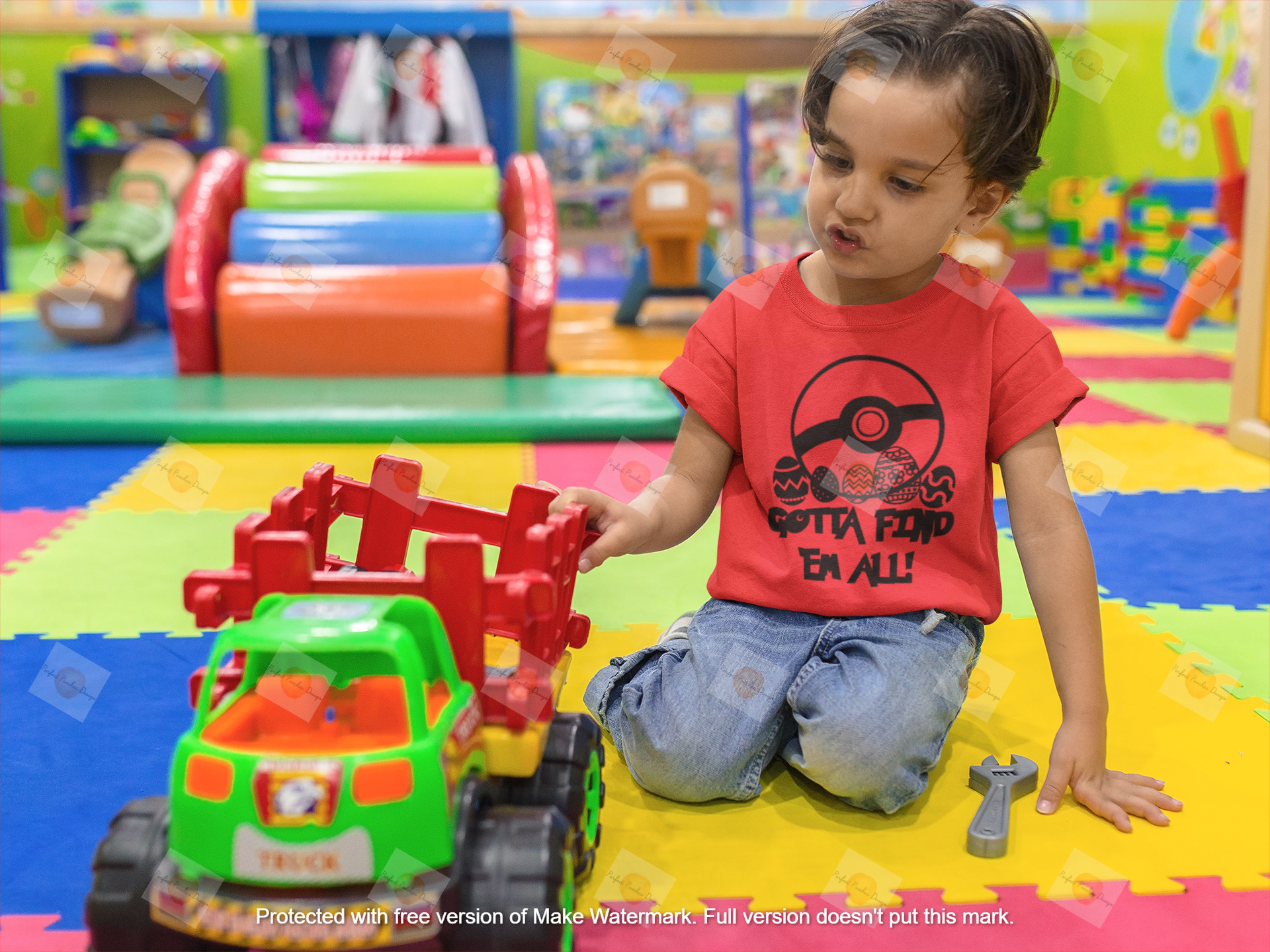 mockup-of-a-kid-playing-with-a-truck-while-wearing-a-t-shirt-mockup-at-the-playground-a16136.png