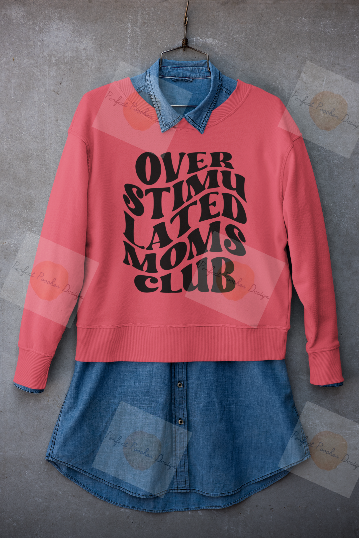 mockup-of-a-crewneck-sweatshirt-placed-on-a-hanger-with-a-denim-garment-33981.png