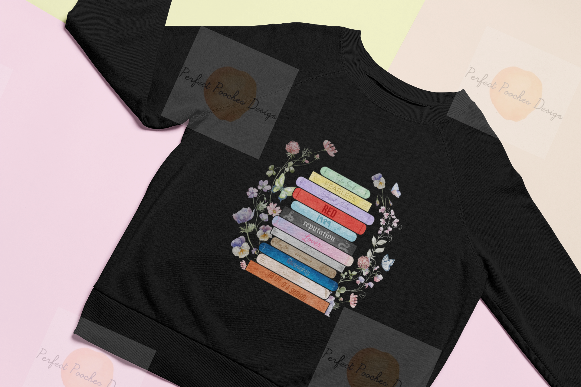 flat-lay-mockup-of-a-sweatshirt-over-colored-pasteboards-24736.png