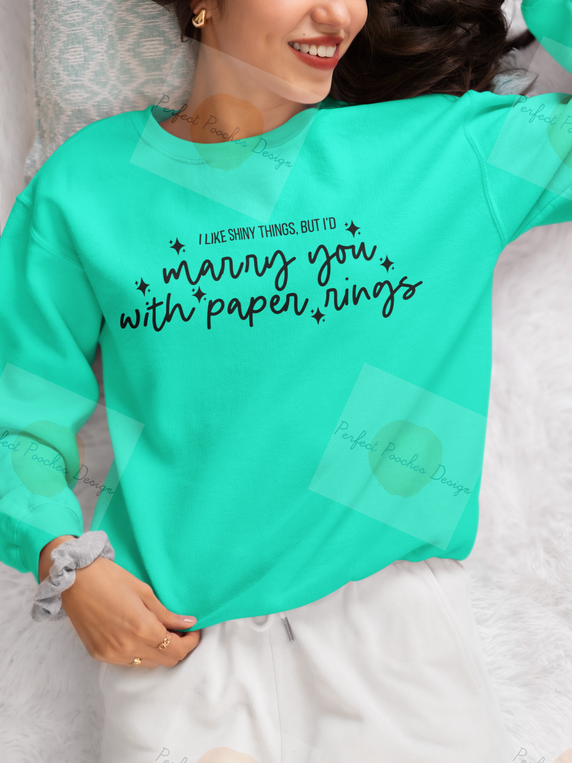 gildan-sweatshirt-mockup-featuring-a-smiling-cropped-face-woman-lying-on-a-bed-m37306.png