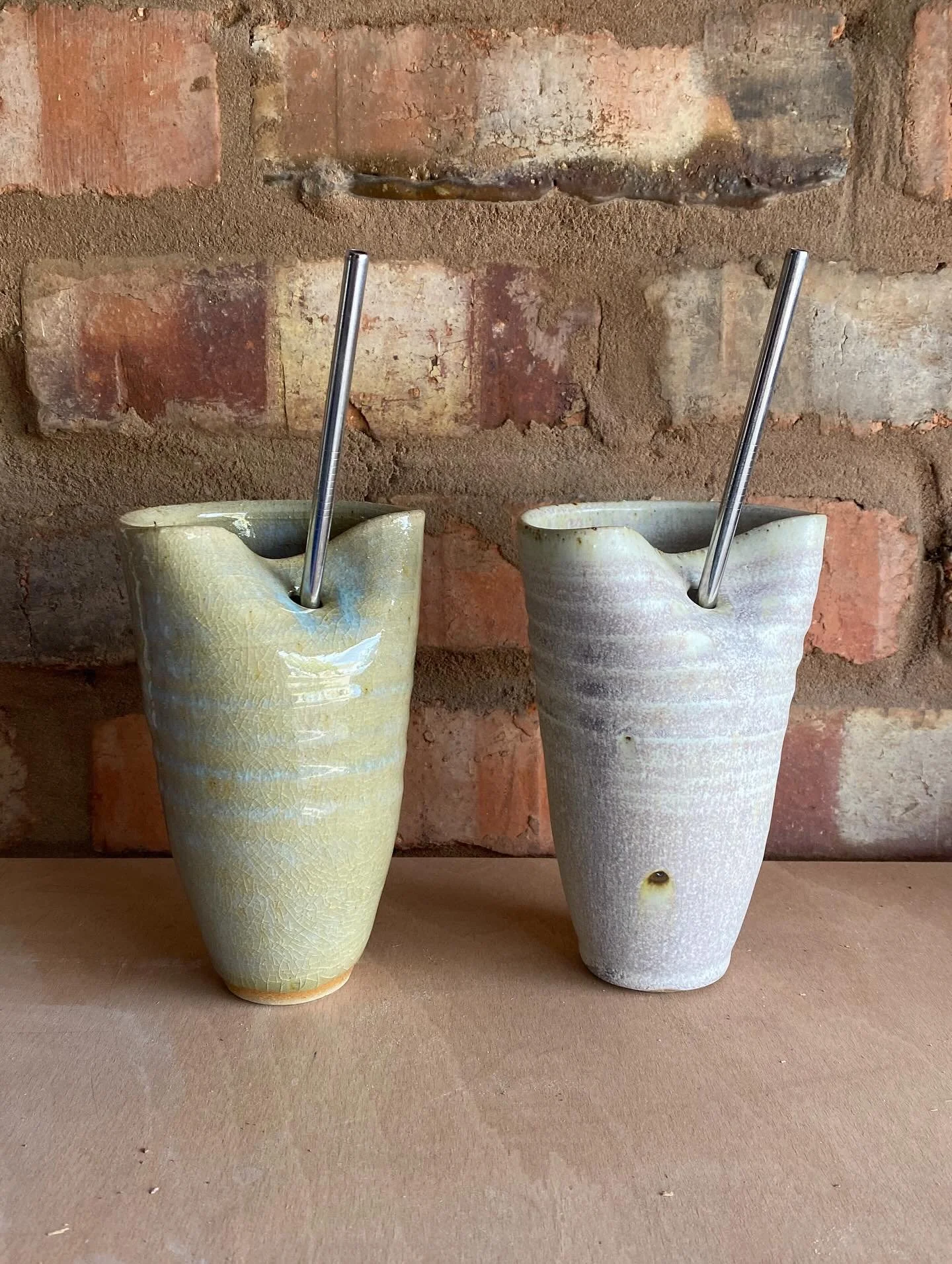 Some rather special latte glasses. The one on the left glazed in a recycled wood ash glaze, the other in the usual Matt white, but fired in a wood kiln to 1300&deg;c.

 Firing in the wood kiln can change the white glaze to a delicate pinky purple. Wh