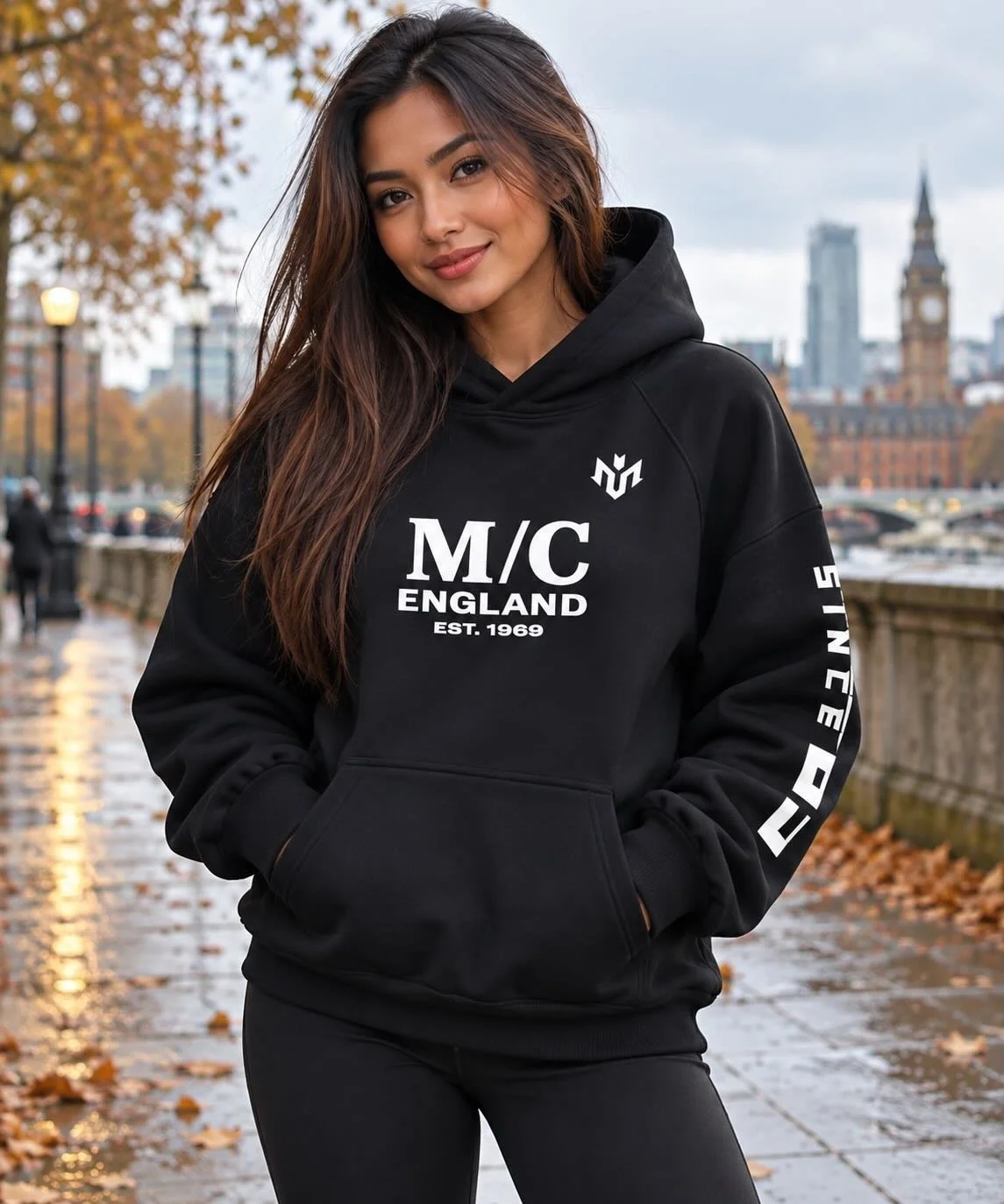Woman wearing a M.U.S.T. Fit® Sports 560 GSM super heavyweight hoodie outdoors in autumn