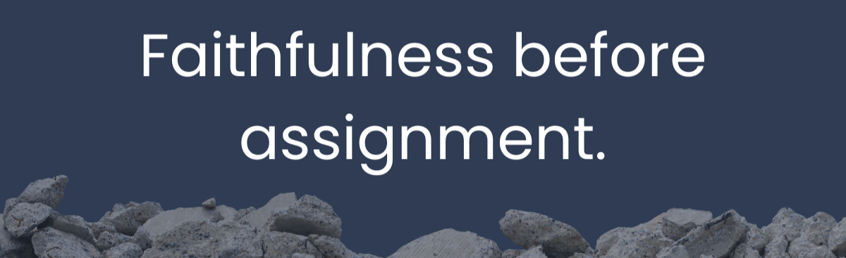 Close-up of a weathered stone wall with broken rocks and rough texture against a dark background with the text "Faithfulness before assignment."