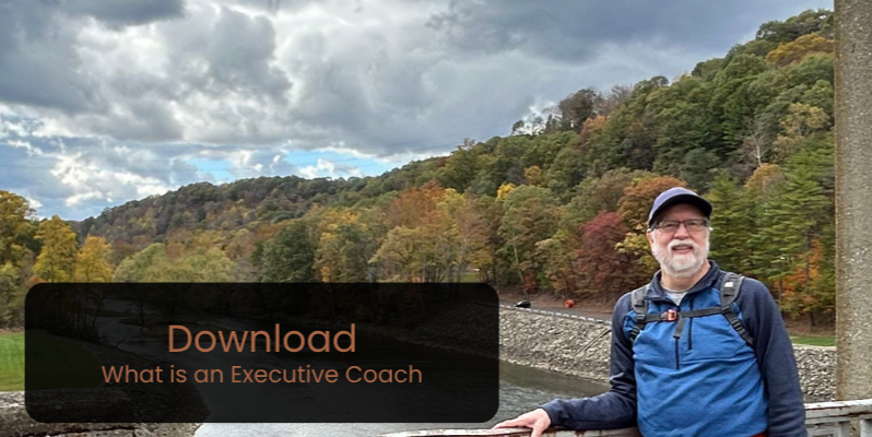Photo of Coach Scott on a scenic overlook with button text ‘Download What Is an Executive Coach,’ linking to a free leadership guide.