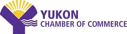 Logo of the Yukon Chamber of Commerce featuring a purple Y shape with a yellow sunburst design.