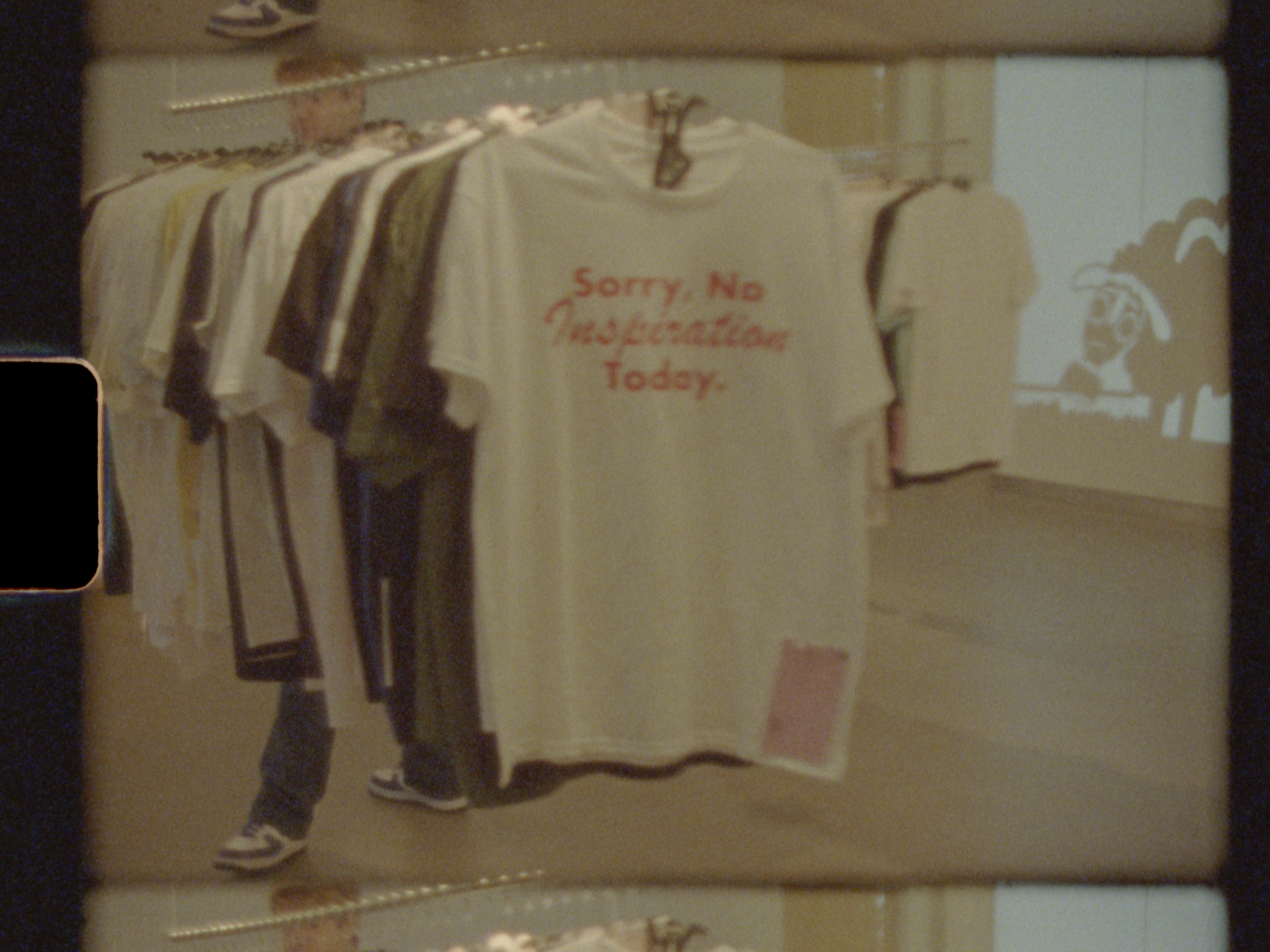 Super 8 still from event night of my college class' "Glomference". Me and my peers were tasked with collaboratively creating a brand and its identity for a t-shirt pop-up shop. Every student created 5-10 one of one t-shirts for an inventory of 200.