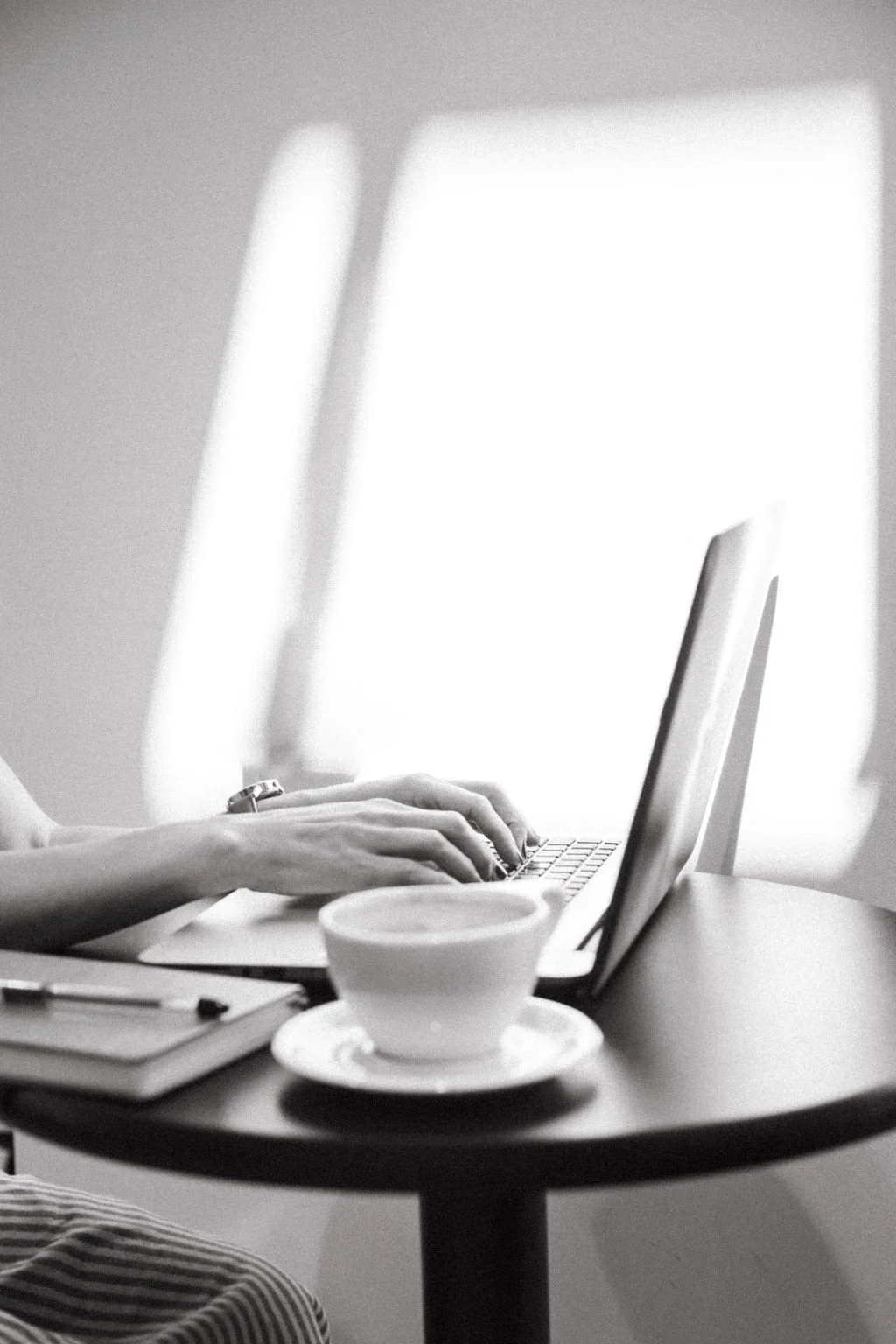 SEO website copywriter stephanie mcguirt typing on a laptop