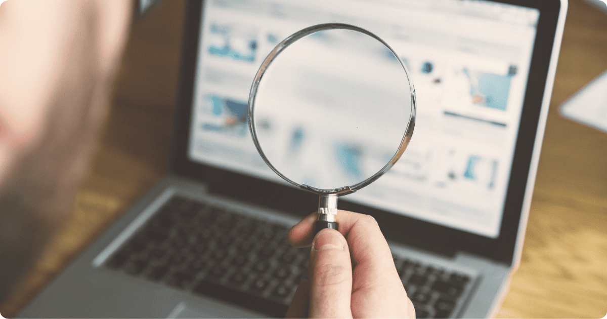 magnifying glass showing computer search screen